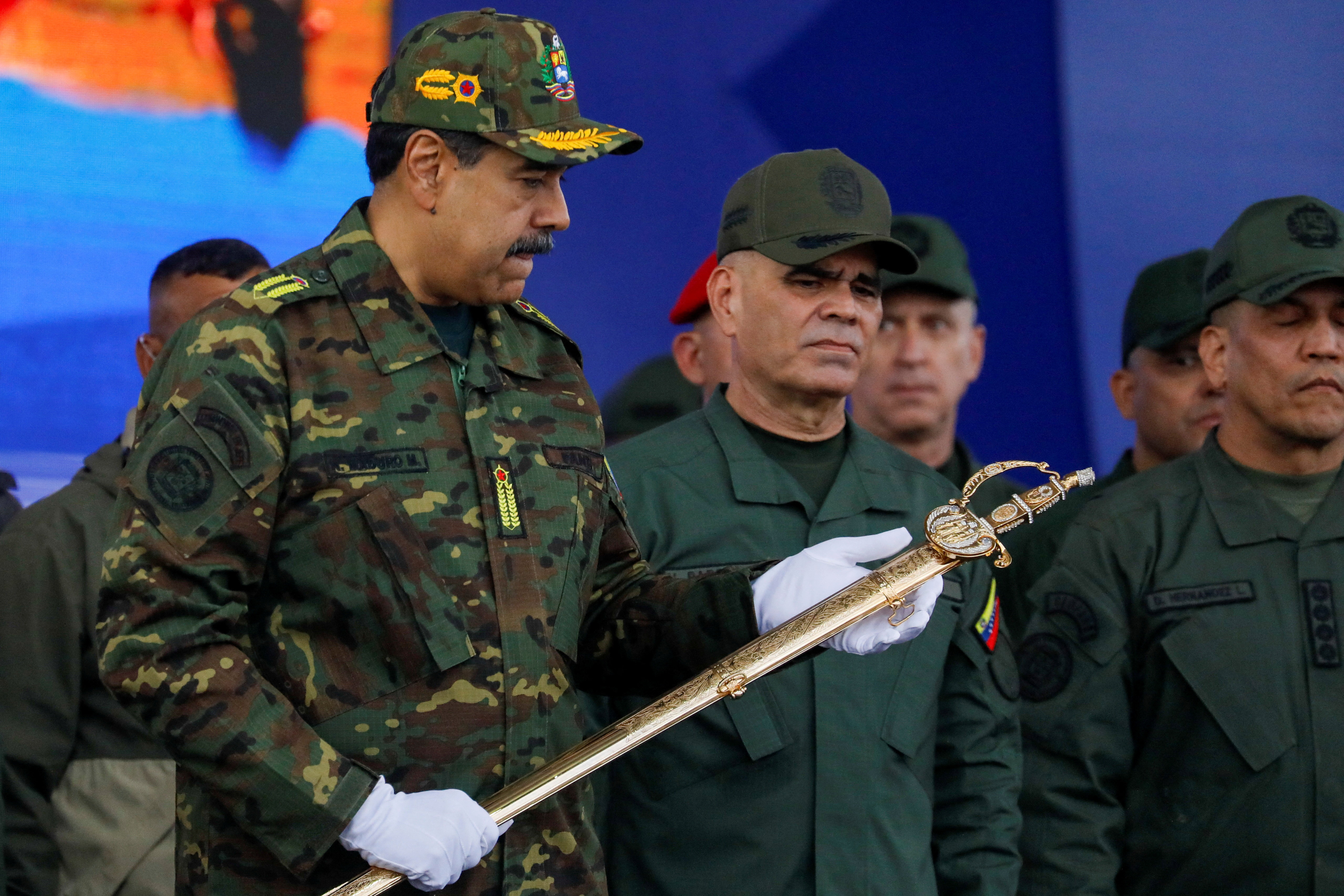 Venezuela's President Nicolas Maduro holds Simon Bolivar's sword 