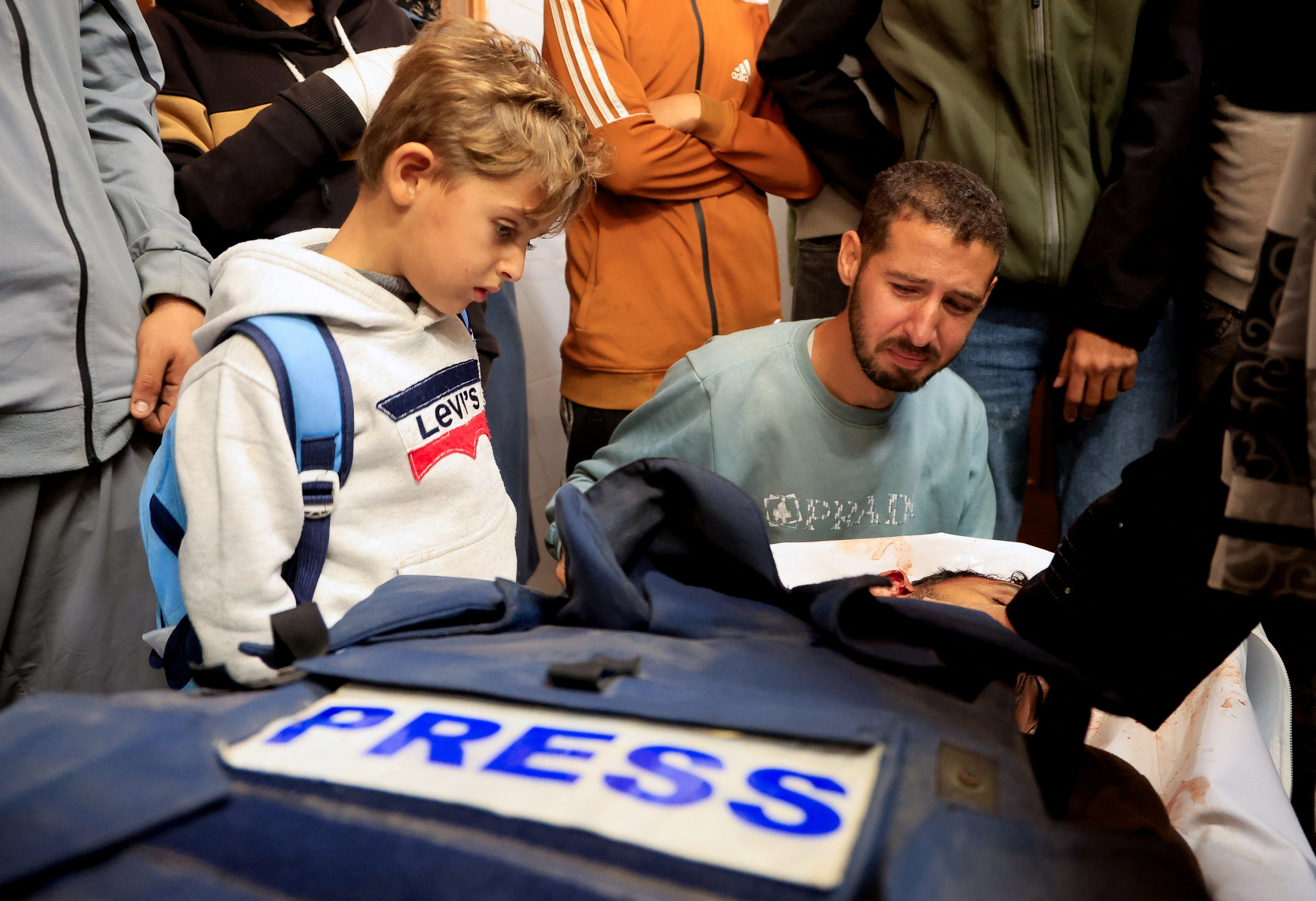 Mourners react next to the body of freelance Palestinian journalist Mahmoud Wadi, who was killed in an Israeli strike in the southern Gaza Strip, December 2, 2025. [File: Haseeb Alwazeer/Reuter]
