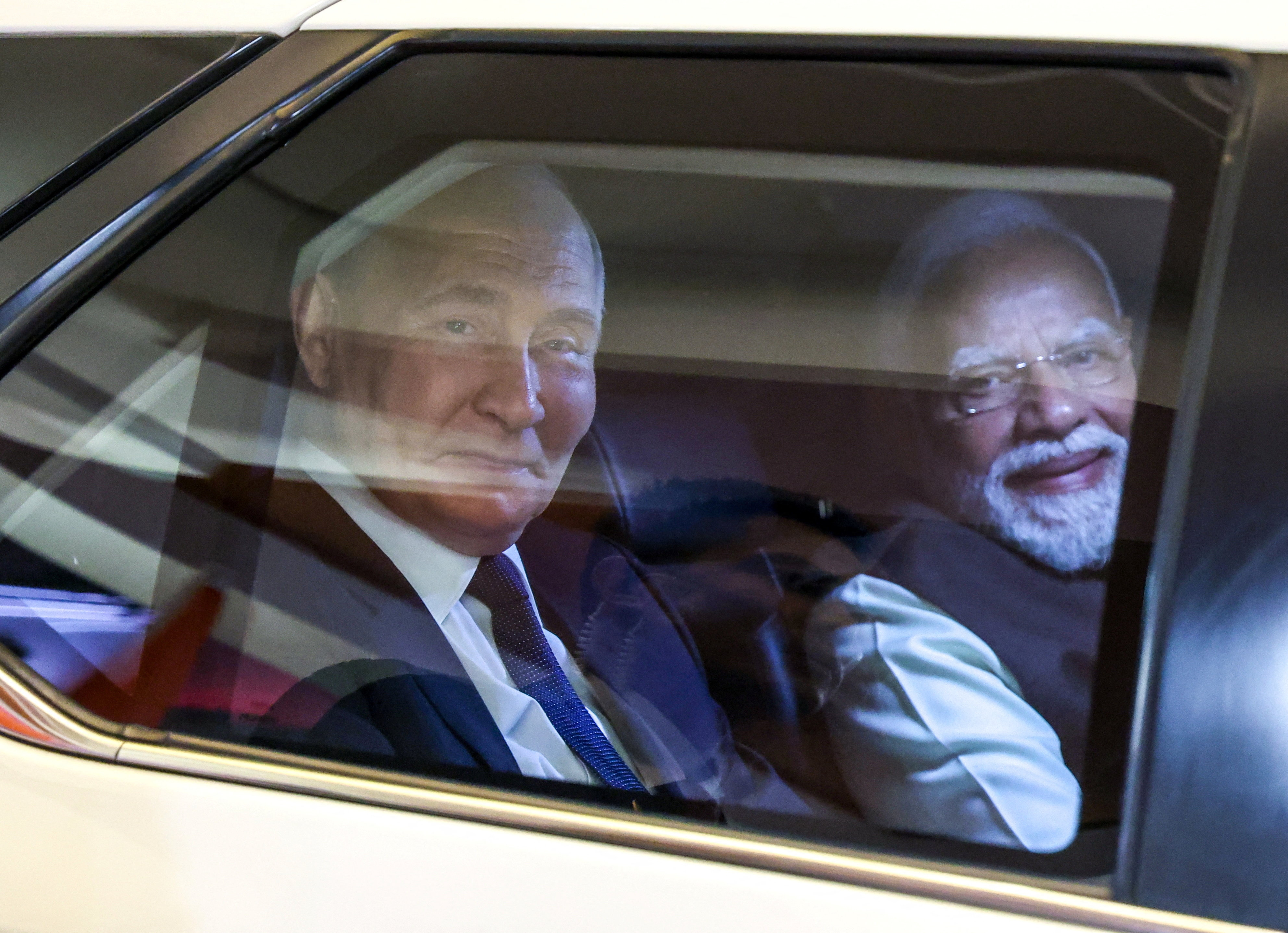 Russian President Vladimir Putin and Indian Prime Minister Narendra Modi arrive for an informal dinner at the Prime Minister's Residence in New Delhi, India December 4, 2025. Sputnik/Alexander Kazakov/Pool via REUTERS ATTENTION EDITORS - THIS IMAGE WAS PROVIDED BY A THIRD PARTY.