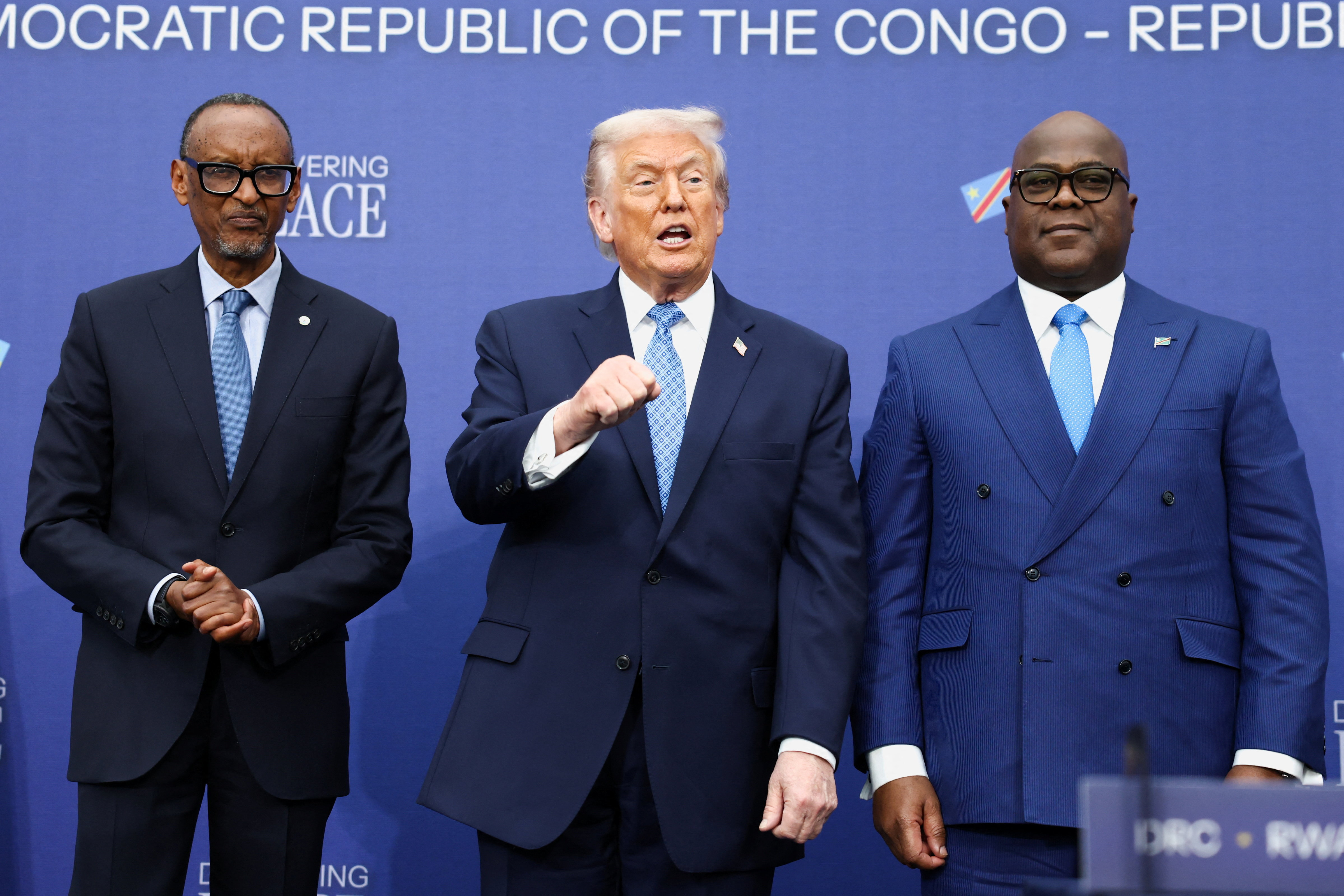 From left, Rwandan President Paul Kagame, US President Donald Trump and DRC President Felix Tshisekedi attend a signing ceremony in Washington, DC, on December 4 [Kevin Lamarque/Reuters]