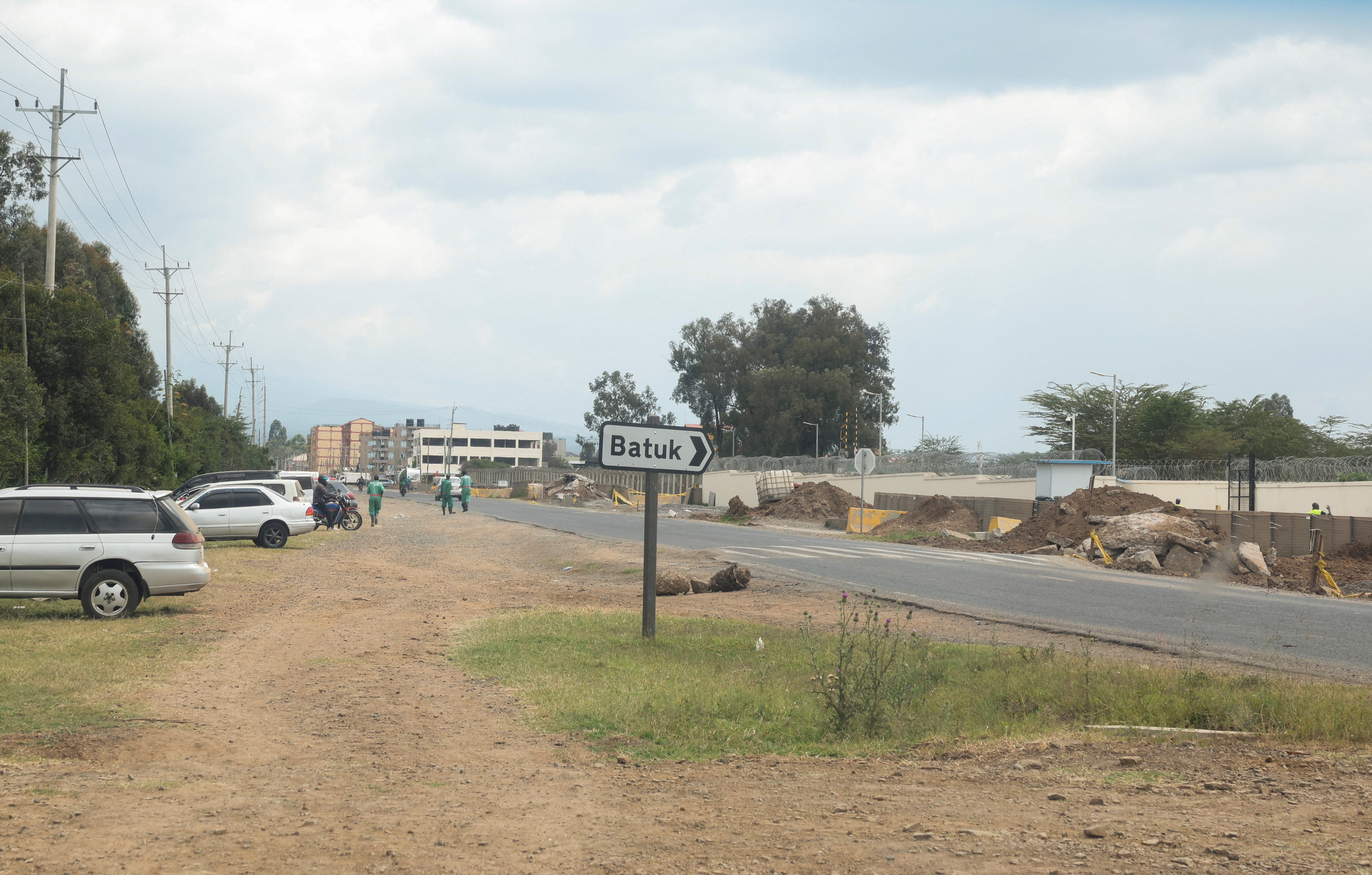 A British Army Training Unit Kenya (BATUK) signage stands next to the road. In 2025, Kenya's parliament accused British soldiers of decades of sexual abuse, killings, human rights violations and environmental destruction while training in the country, in Nanyuki, Laikipia County, Kenya [Monicah Mwangi/Reuters]