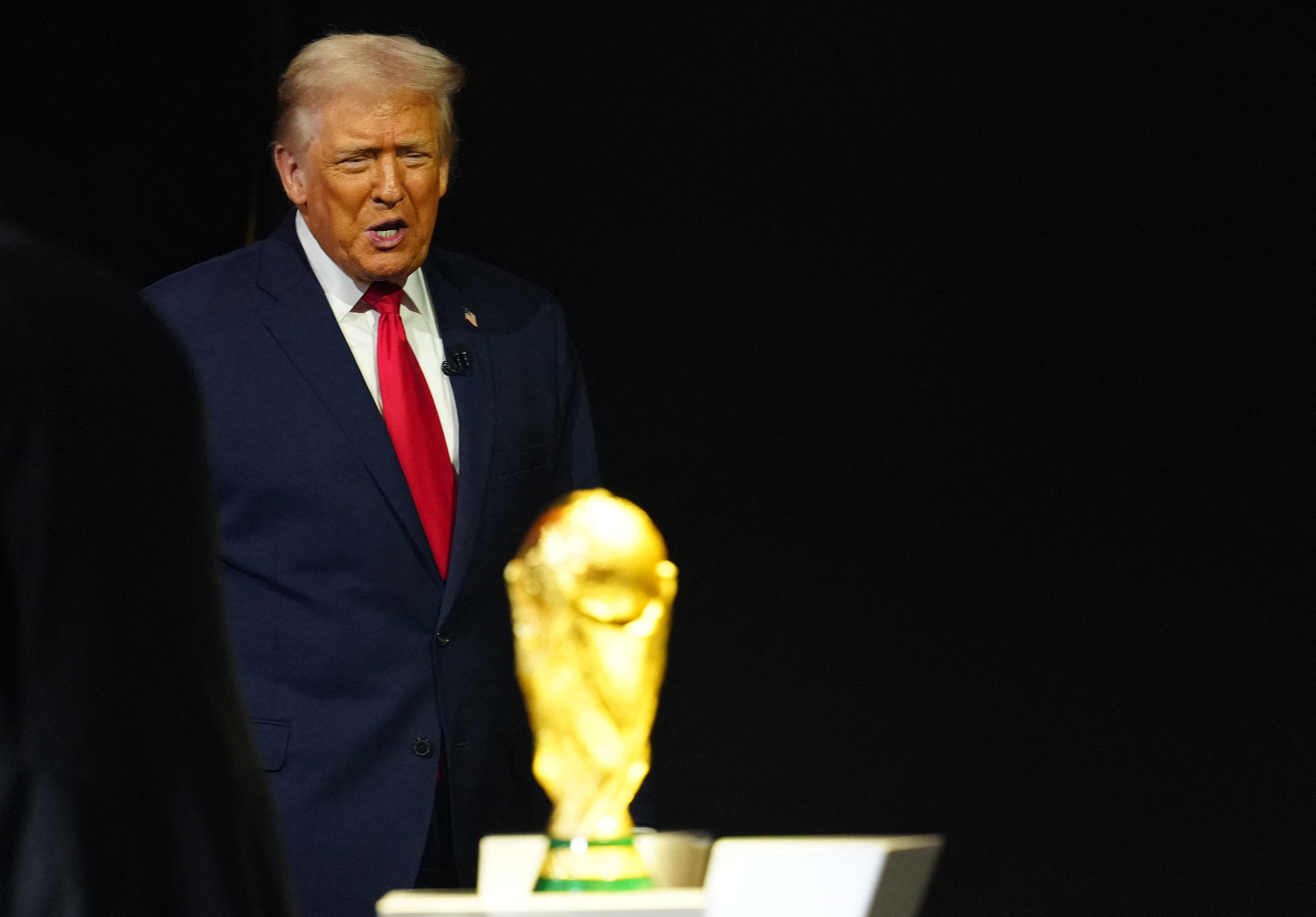 Soccer Football - FIFA World Cup 2026 - FIFA World Cup 2026 Draw - John F. Kennedy Center for the Performing Arts, Washington, D.C., U.S. - December 5, 2025 U.S. President Donald Trump with the World Cup trophy during the FIFA World Cup 2026 Draw Pool via REUTERS/Jia Haocheng