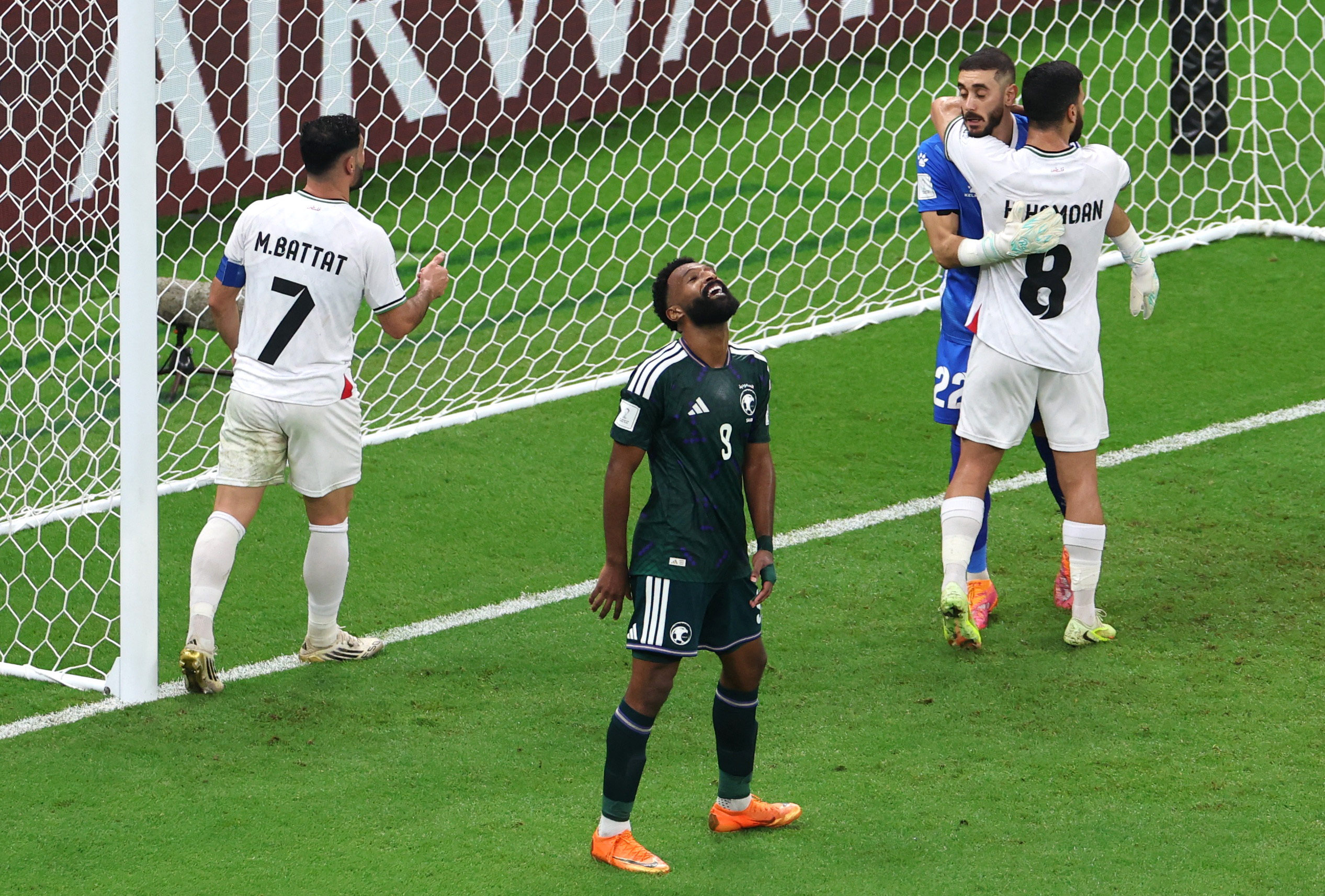 Saudi Arabia's Firas Al Buraikan, Palestine's Hamed Hamdan, Palestine's Ikram Rami Hamadeh and Palestine's Musab Al Battat react 
