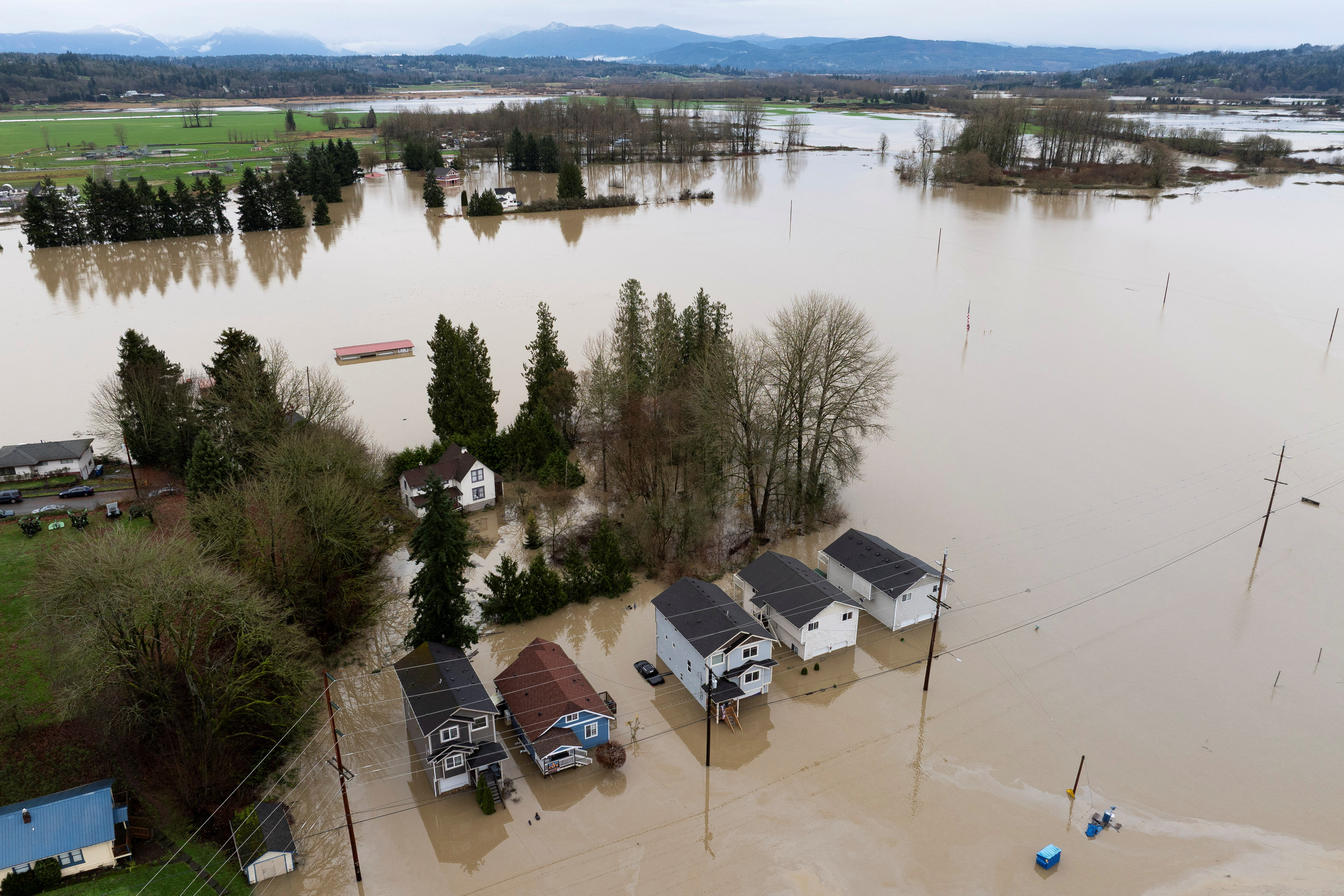 A drone view shows an area flooded by the Snohomish River, as an atmospheric river brings rain and flooding to the Pacific Northwest, in Snohomish, Washington, U.S., December 11, 2025. REUTERS/David Ryder