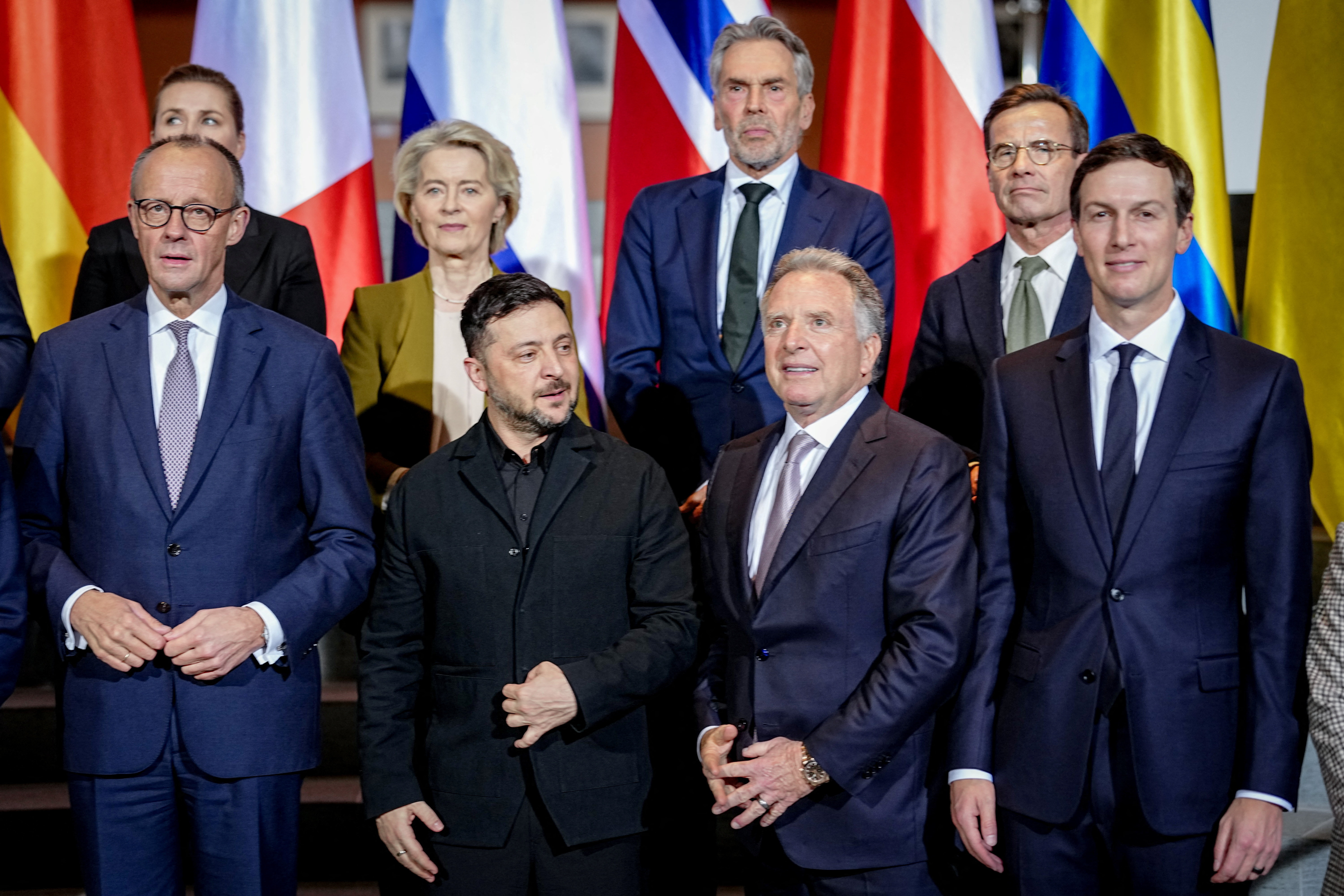 Ukraine's President Volodymyr Zelenskiy and U.S. Special Envoy Steve Witkoff, Jared Kushner, the son-in-law of U.S. President Donald Trump, German Chancellor Friedrich Merz and European Commission President Ursula von der Leyen line up for a photo opportunity at the Chancellery in Berlin, Germany, December 15, 2025. [Kay Nietfeld/Reuters]