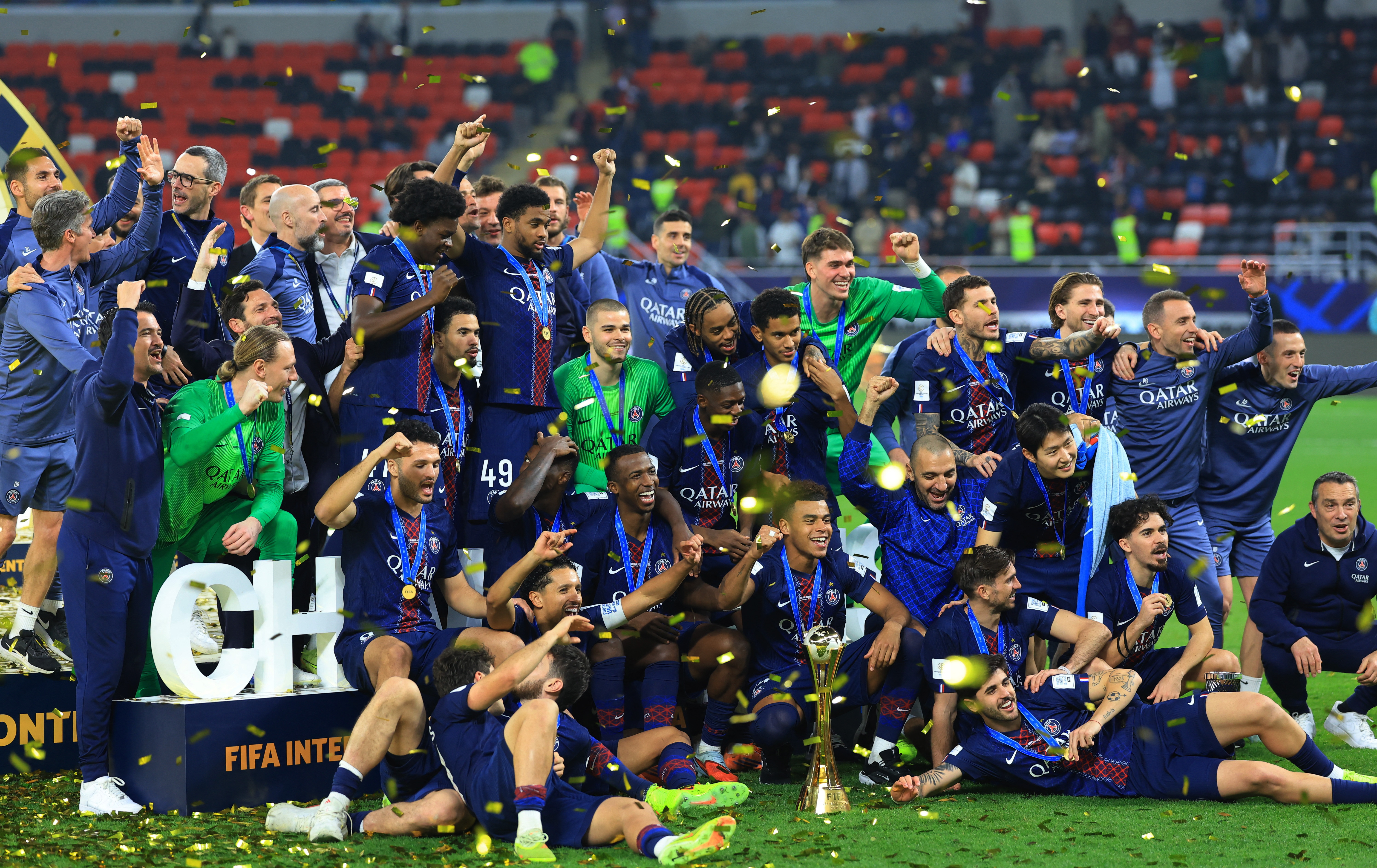 Paris St Germain's players celebrate with the trophy after winning the FIFA Intercontinental cup final