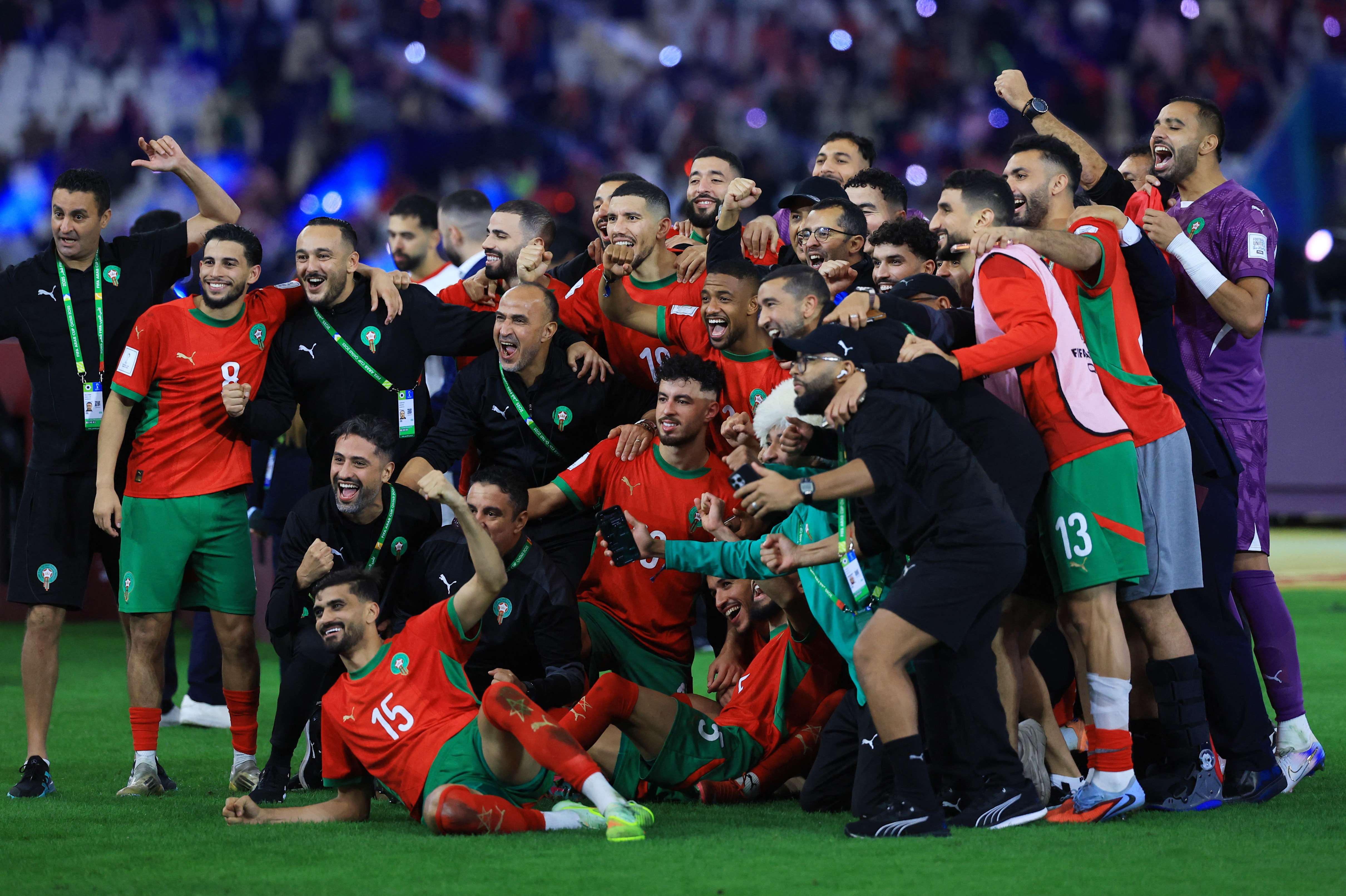 Morocco players and staff pose for a picture after winning the FIFA Arab Cup