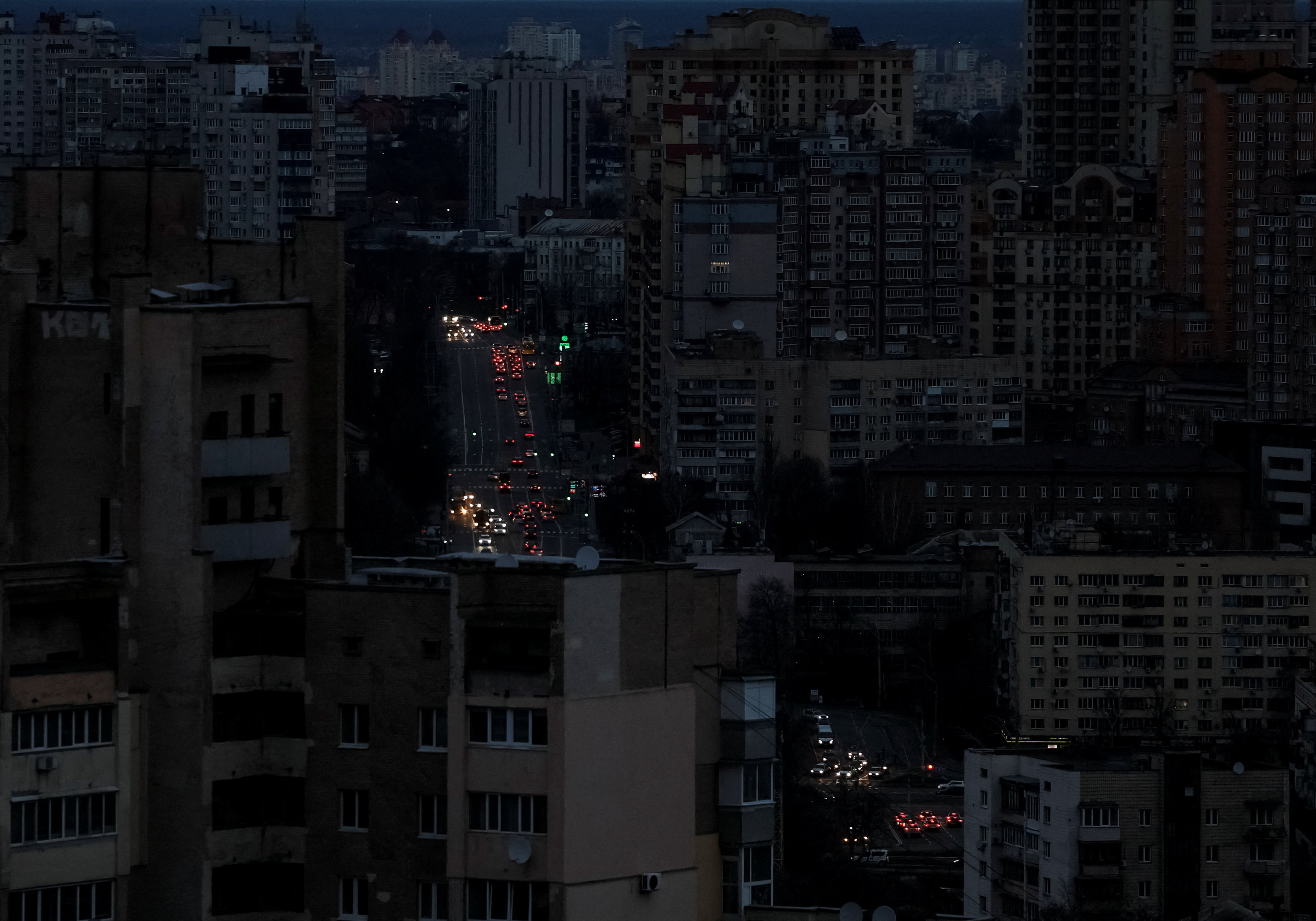 Traffic moves through the city centre during a blackout after civil infrastructure was hit by Russian drones and missile attacks, in Kyiv