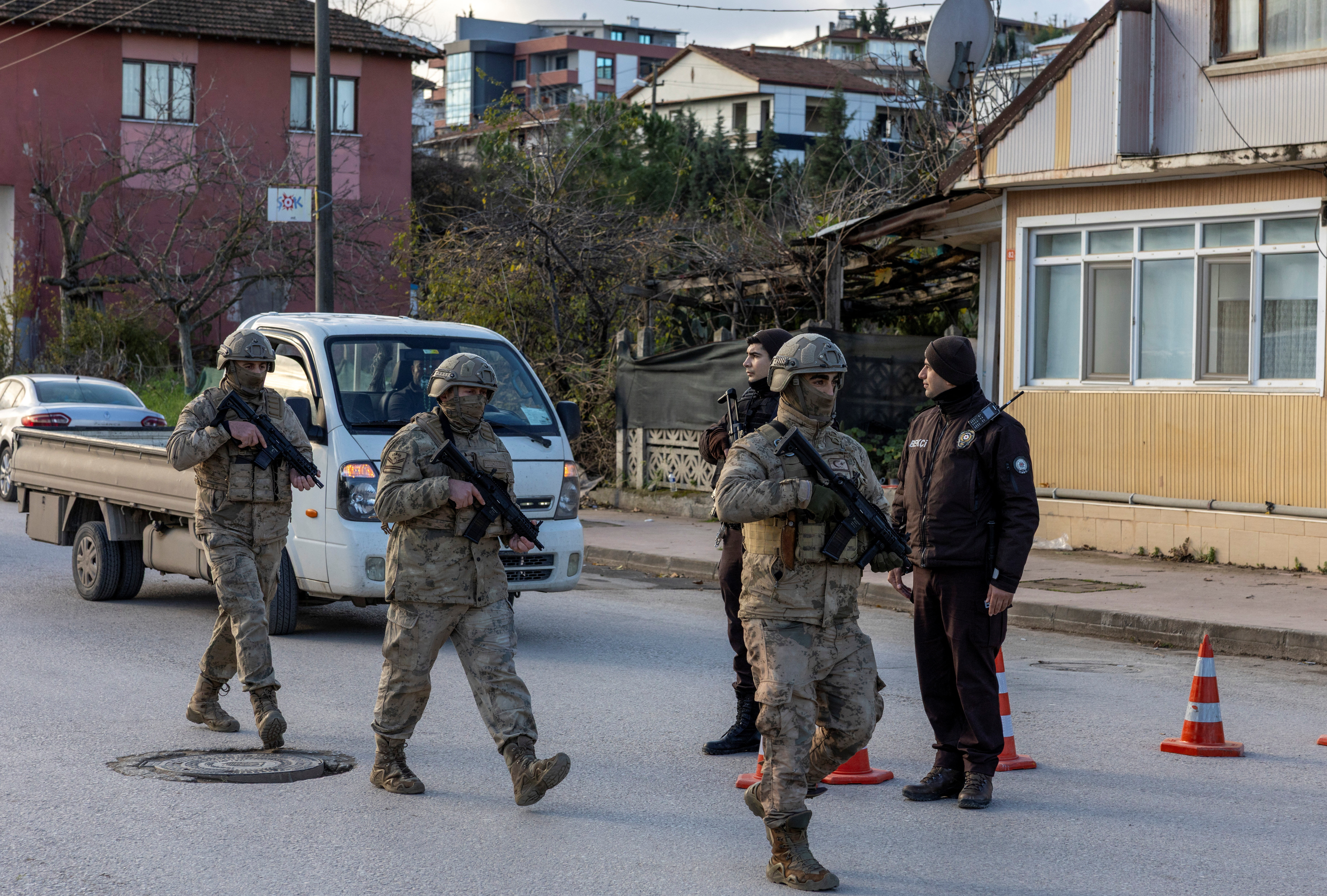 Turkish gendarmerie special forces team leaves the site where Turkish security forces launched an operation on a house.
