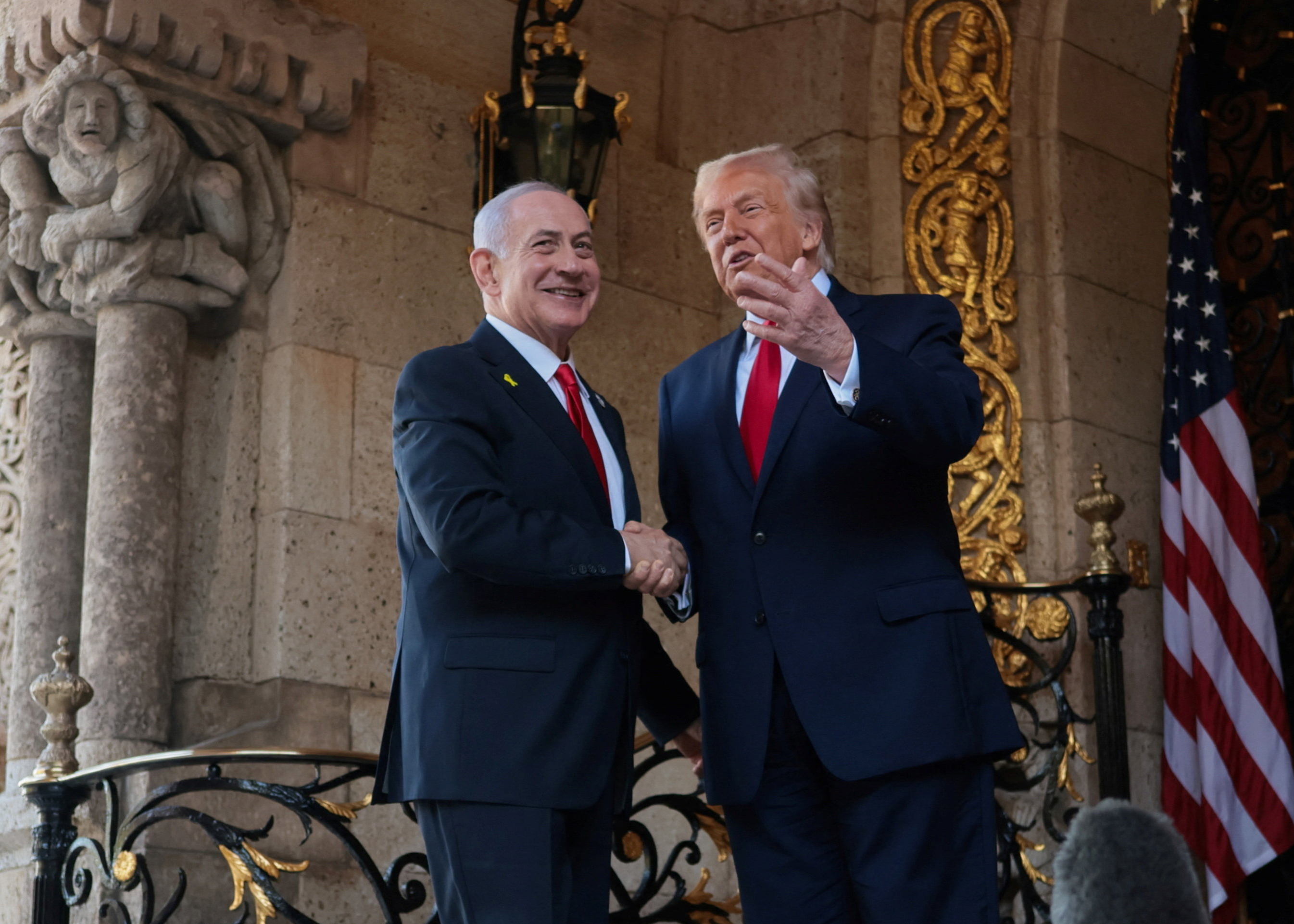 U.S. President Donald Trump greets Israeli Prime Minister Benjamin Netanyahu upon arrival for meetings at Trump's Mar-a-Lago club in Palm Beach, Florida, U.S., December 29, 2025. [Jonathan Ernst/Reuters]