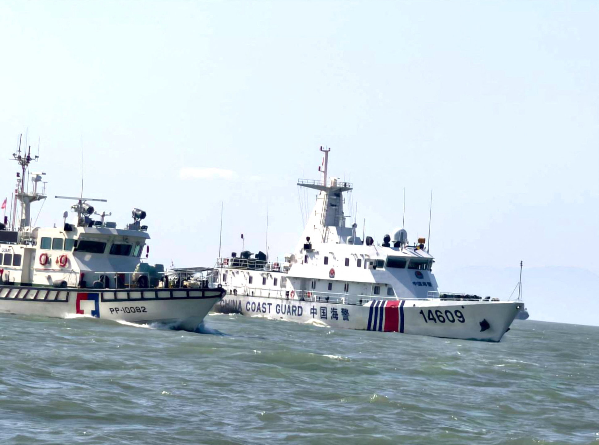 A Taiwan Coast Guard vessel travels near a China Coast Guard vessel as China conducts military drills around Taiwan, in this handout image provided December 30, 2025. Taiwan Coast Guard/Handout via REUTERS ATTENTION EDITORS - THIS IMAGE WAS PROVIDED BY A THIRD PARTY. NO RESALES. NO ARCHIVES.
