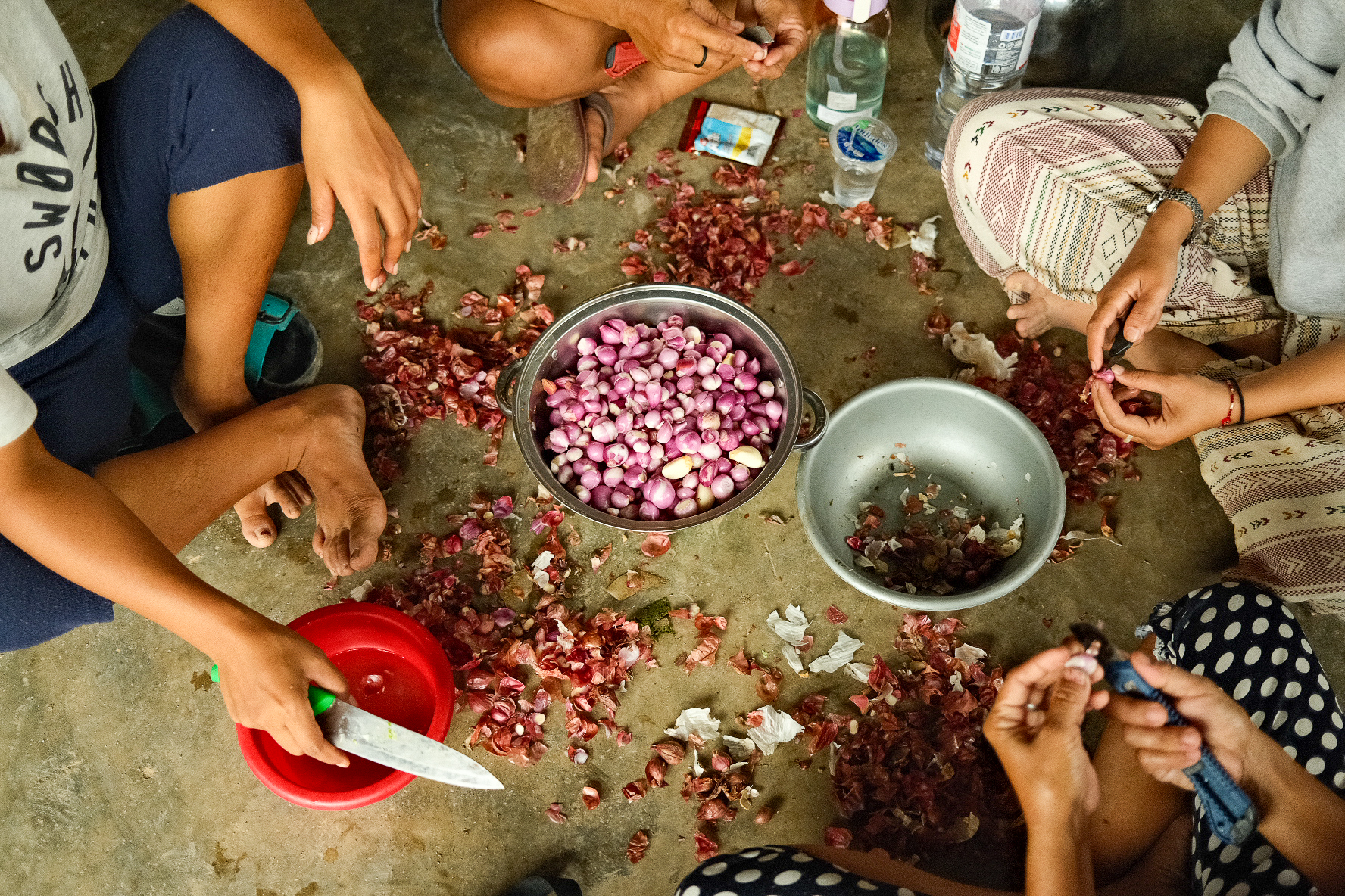 At a church in North Tapanuli, women work together to prepare meals for the evacuees. 