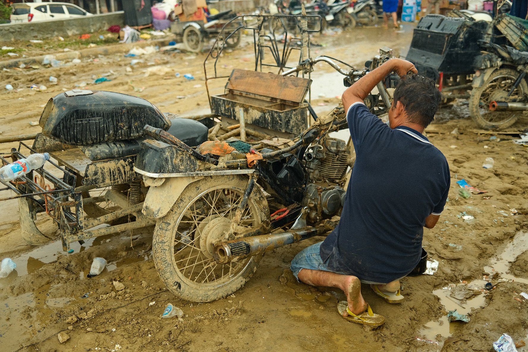 People around Aceh Tamiang have been trying to salvage their possessions. Thousands of cars and motorbikes line the streets, most of them damaged beyond repair.
