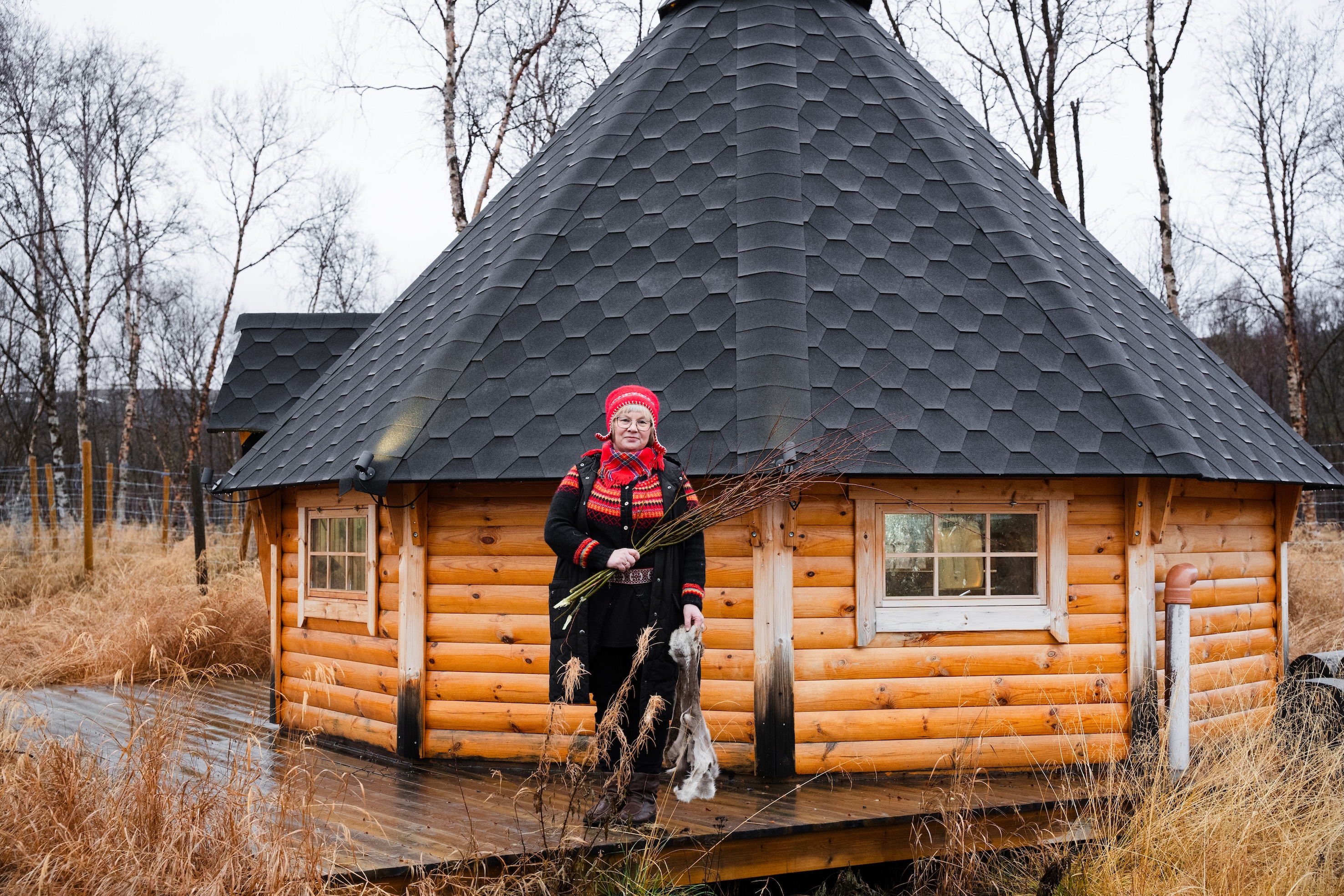 Ellinor Guttorm Utsi in front of her house in Norway
