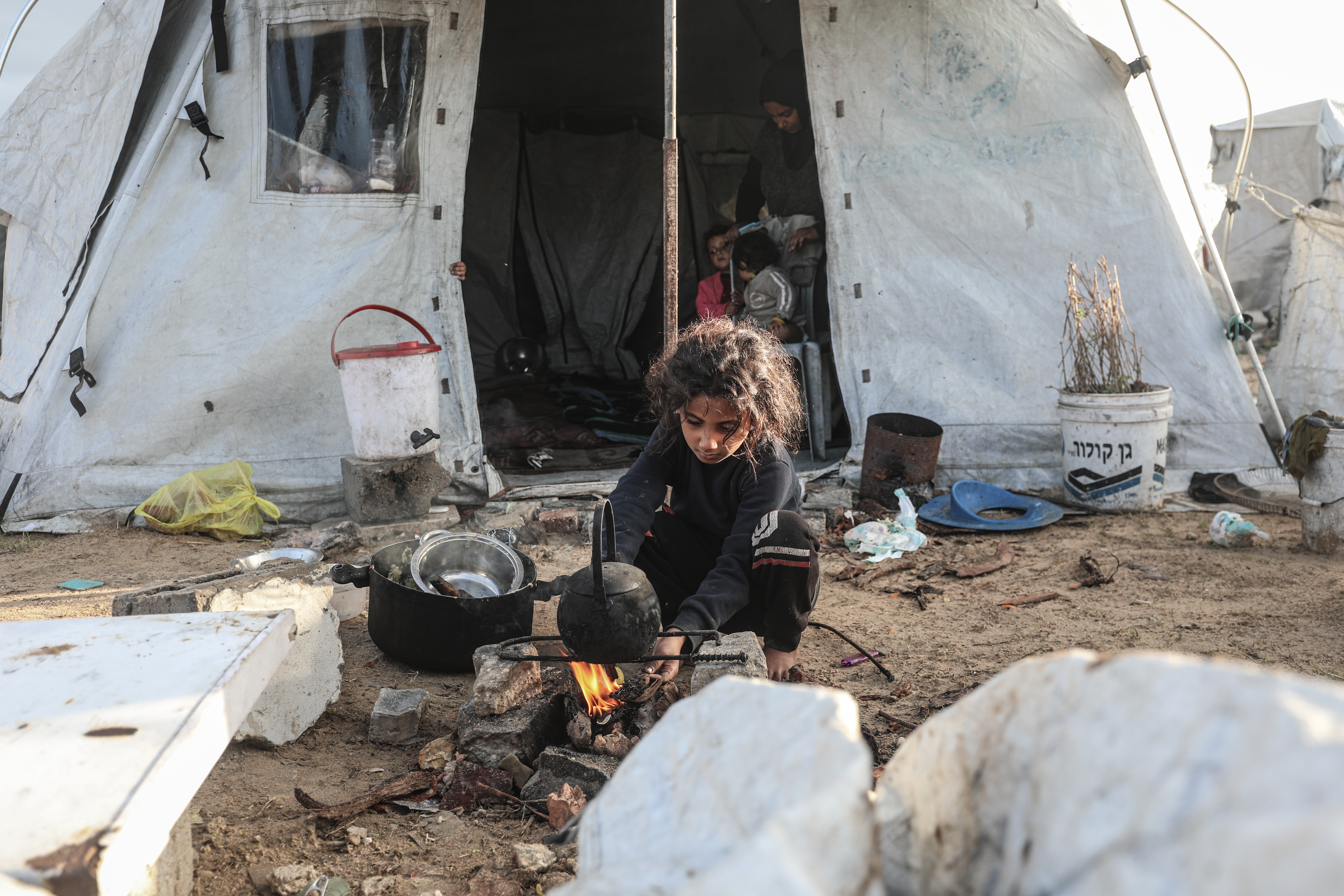 Flooding hits displaced Palestinians’ tents after heavy rain in Gaza