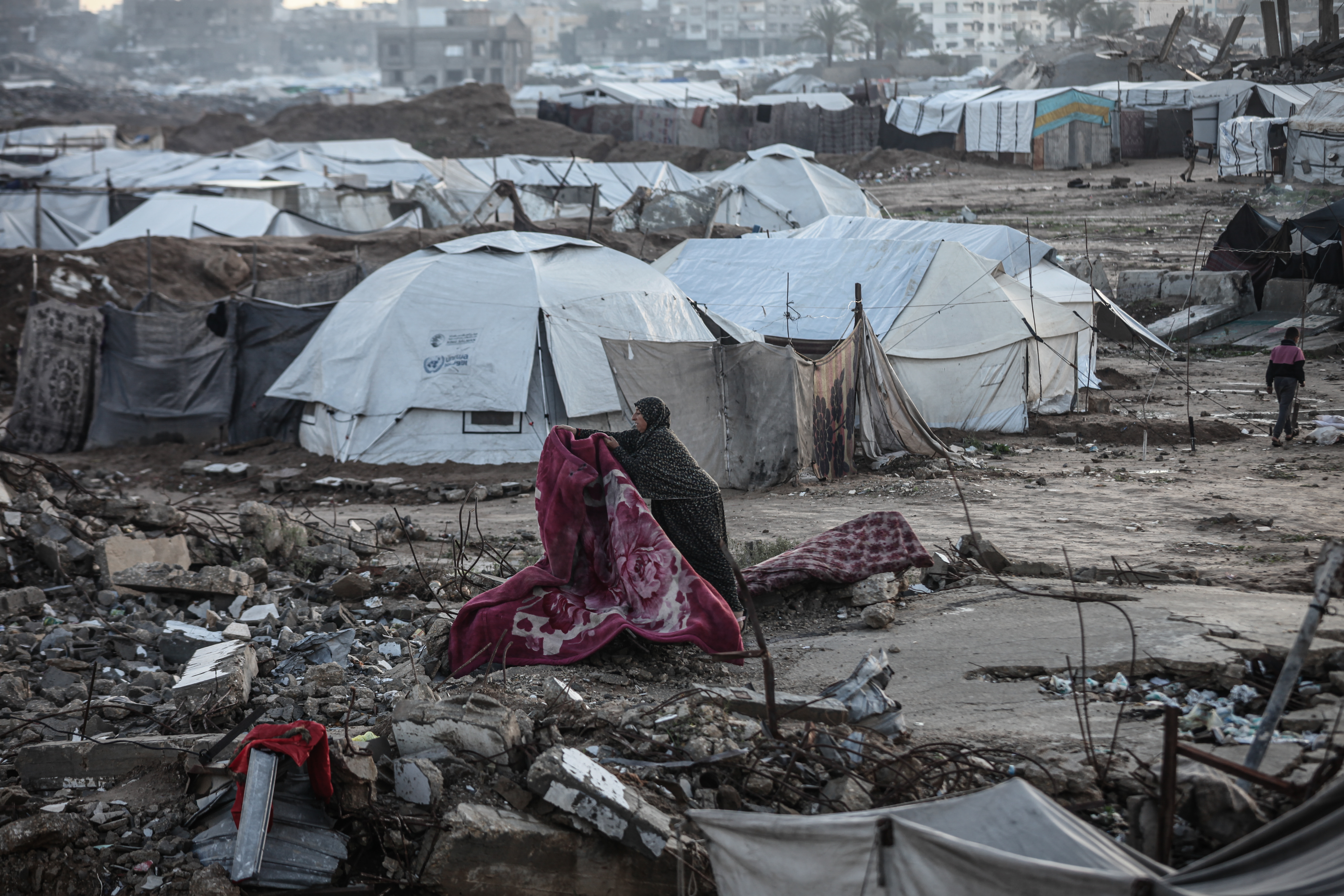 Flooding hits displaced Palestinians’ tents after heavy rain in Gaza