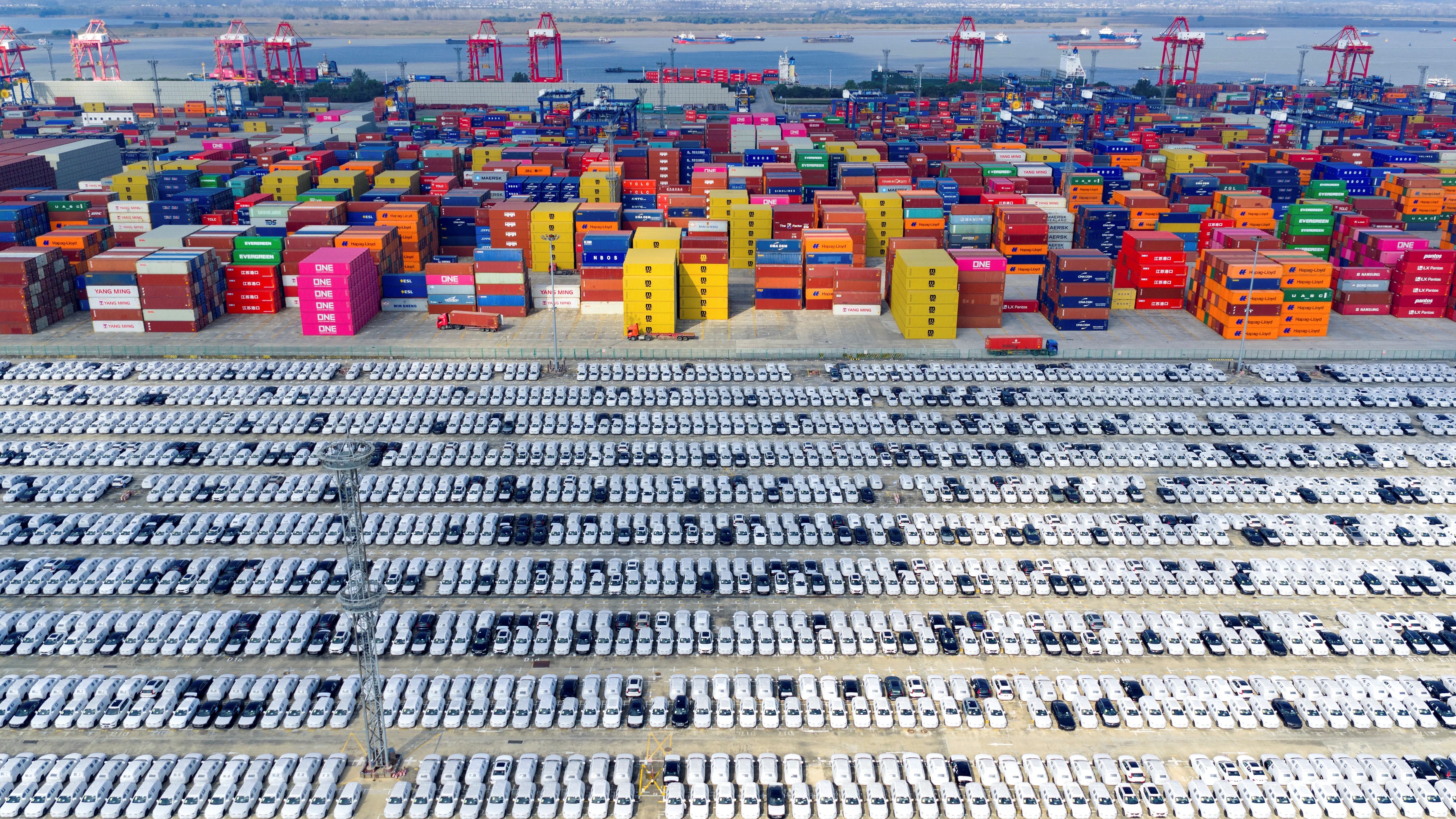 Cars for export are seen at a port in Nanjing, China