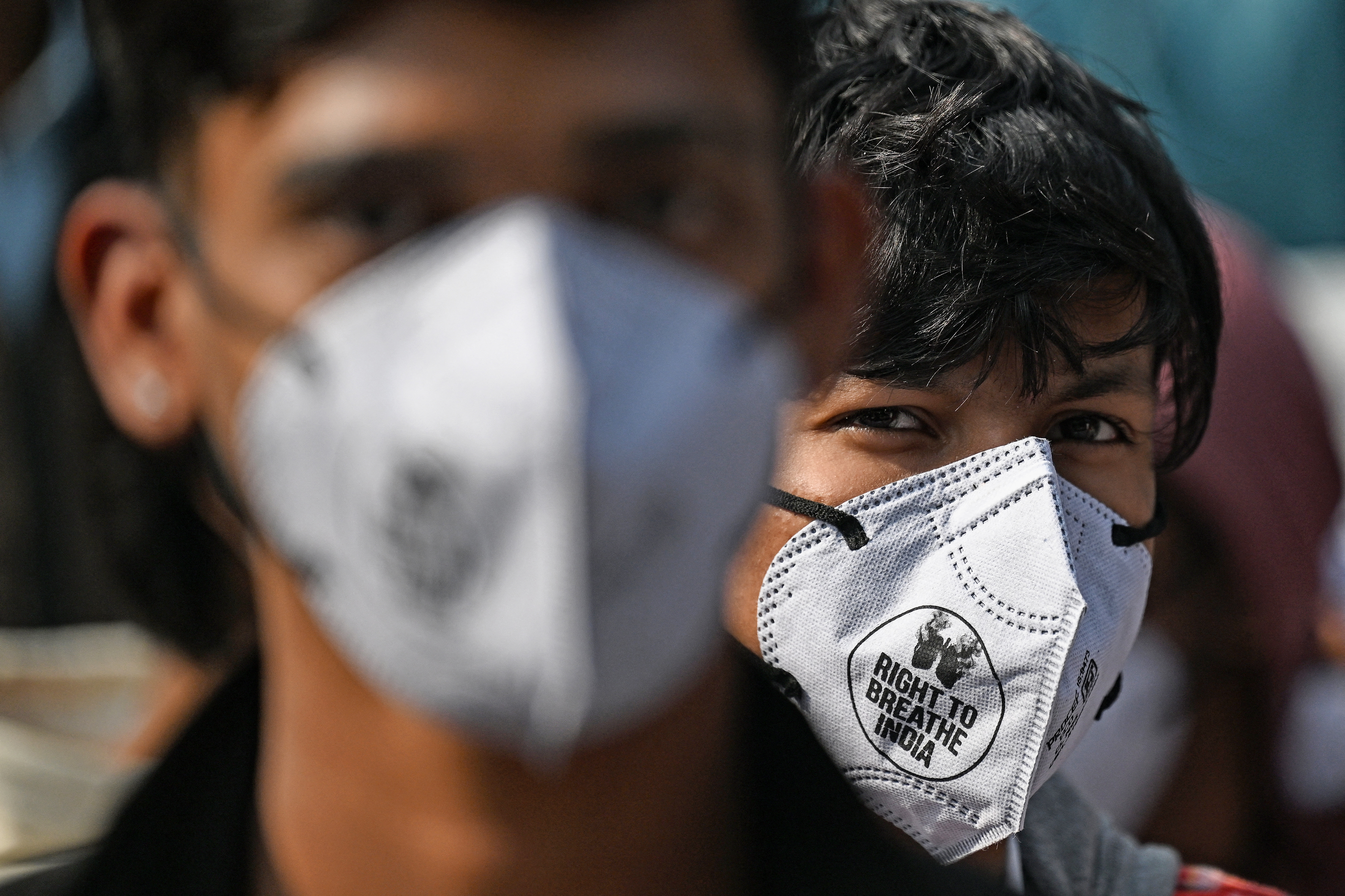 Demonstrators wearing masks take part in a protest demanding the government take action to reduce air pollution in New Delhi on December 3, 2025 [Sajjad Hussain/AFP]