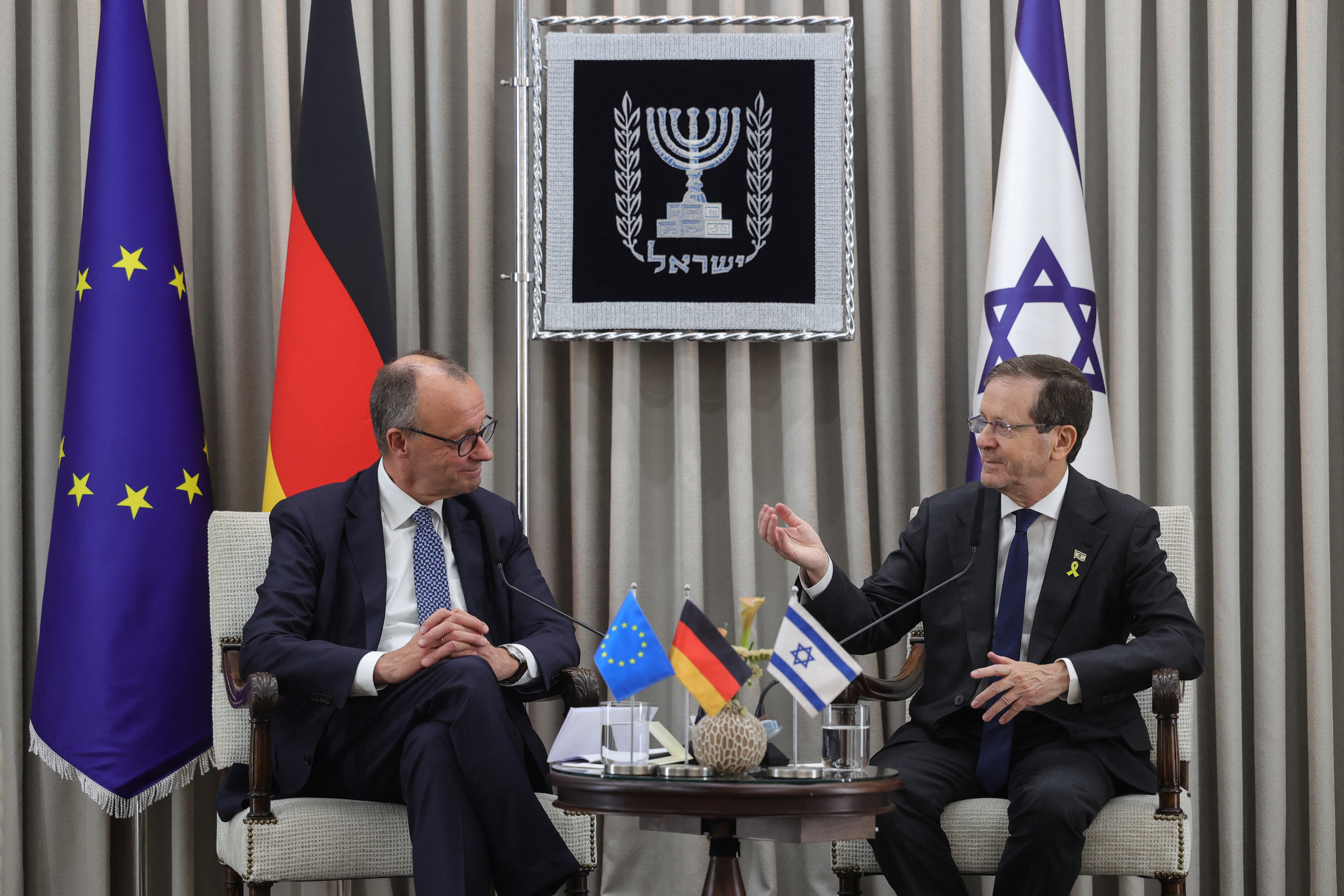 German Chancellor Friedrich Merz (L) meets with Israel's President Isaac Herzog at the president's residence in Jerusalem on December 6, 2025.