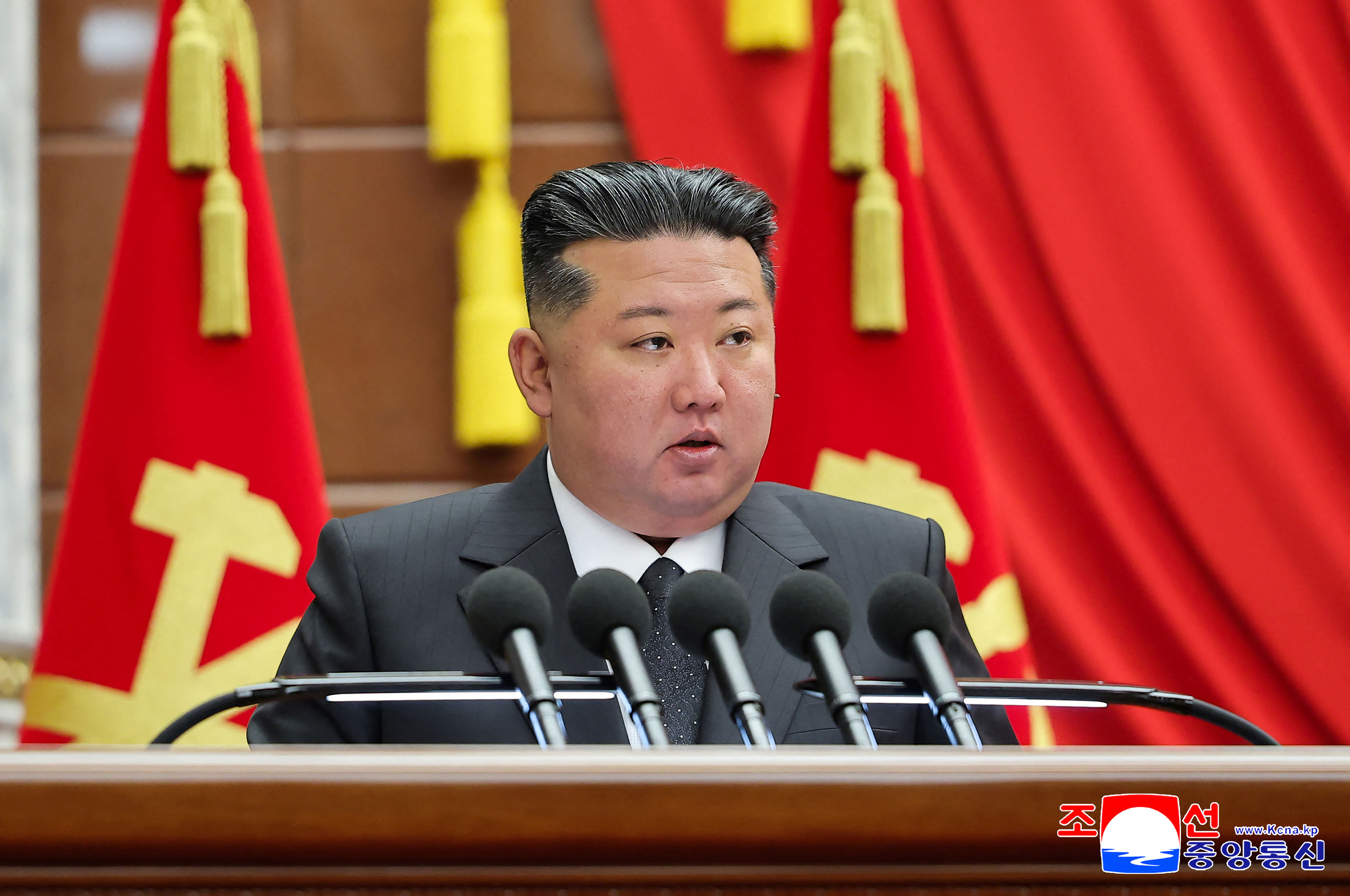 This picture taken on December 10, 2025 and released by North Korea's official Korean Central News Agency (KCNA) on December 11, 2025 shows North Korean leader Kim Jong Un giving closing remarks at the second-day sitting of the 13th Plenary Meeting of the Eighth Central Committee of the Workers' Party of Korea at an unconfirmed location in North Korea. (Photo by KCNA VIA KNS / AFP) / South Korea OUT / SOUTH KOREA OUT / SOUTH KOREA OUT / ---EDITORS NOTE--- RESTRICTED TO EDITORIAL USE - MANDATORY CREDIT "AFP PHOTO/KCNA VIA KNS" - NO MARKETING NO ADVERTISING CAMPAIGNS - DISTRIBUTED AS A SERVICE TO CLIENTS THIS PICTURE WAS MADE AVAILABLE BY A THIRD PARTY. AFP CAN NOT INDEPENDENTLY VERIFY THE AUTHENTICITY, LOCATION, DATE AND CONTENT OF THIS IMAGE. /