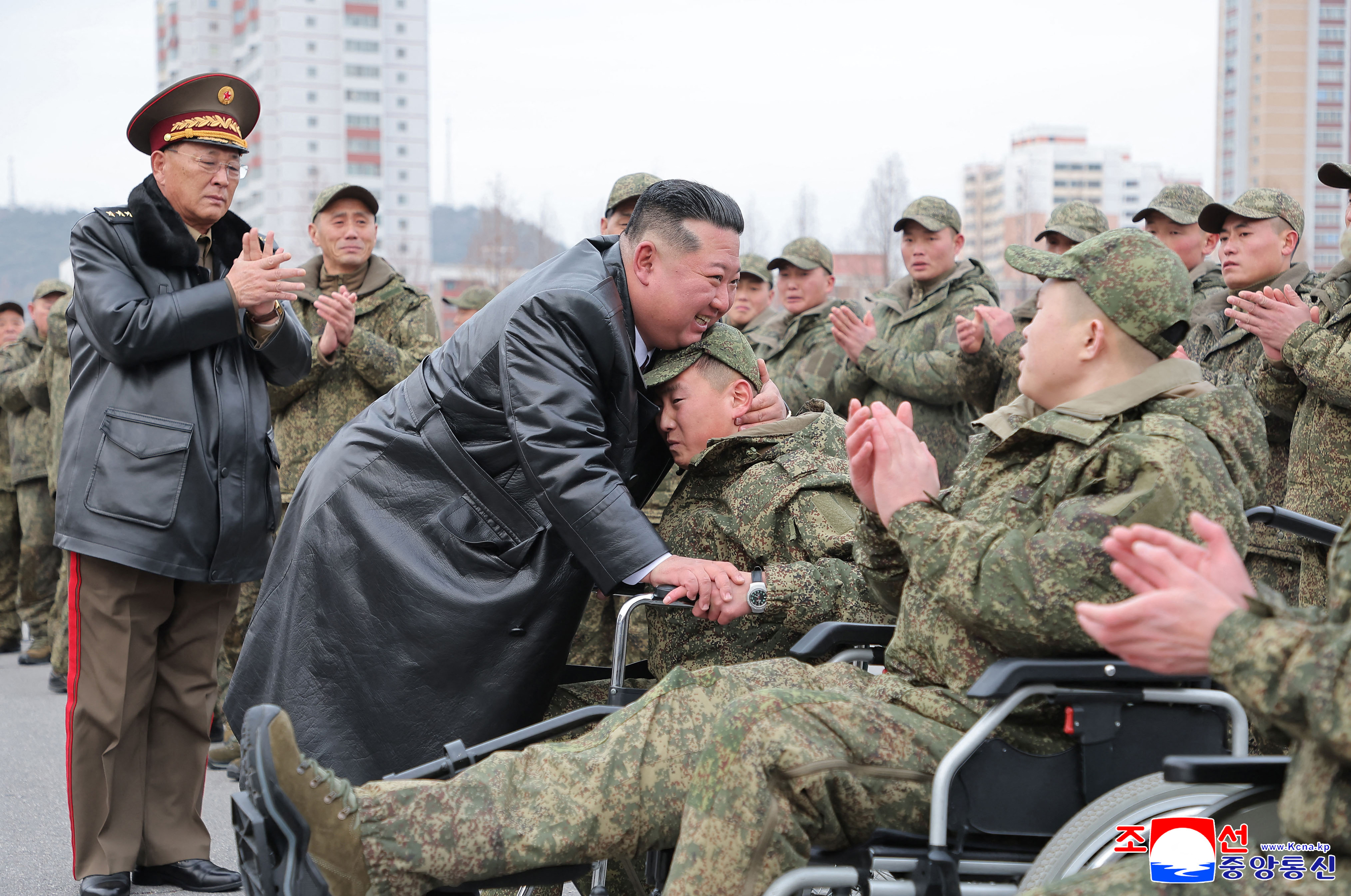 This picture taken on December 12, 2025 and released from North Korea's official Korean Central News Agency (KCNA) on December 13 shows North Korean leader Kim Jong Un welcoming soldiers from the Korean People's Army's 528th Regiment of Engineers, which returned from an overseas deployment in Russia's Kursk region during Moscow's war with Ukraine, in front of the April 25 House of Culture in Pyongyang. (Photo by KCNA VIA KNS / AFP) / South Korea OUT / SOUTH KOREA OUT / SOUTH KOREA OUT / ---EDITORS NOTE--- RESTRICTED TO EDITORIAL USE - MANDATORY CREDIT "AFP PHOTO/KCNA VIA KNS" - NO MARKETING NO ADVERTISING CAMPAIGNS - DISTRIBUTED AS A SERVICE TO CLIENTS / THIS PICTURE WAS MADE AVAILABLE BY A THIRD PARTY. AFP CAN NOT INDEPENDENTLY VERIFY THE AUTHENTICITY, LOCATION, DATE AND CONTENT OF THIS IMAGE --- /