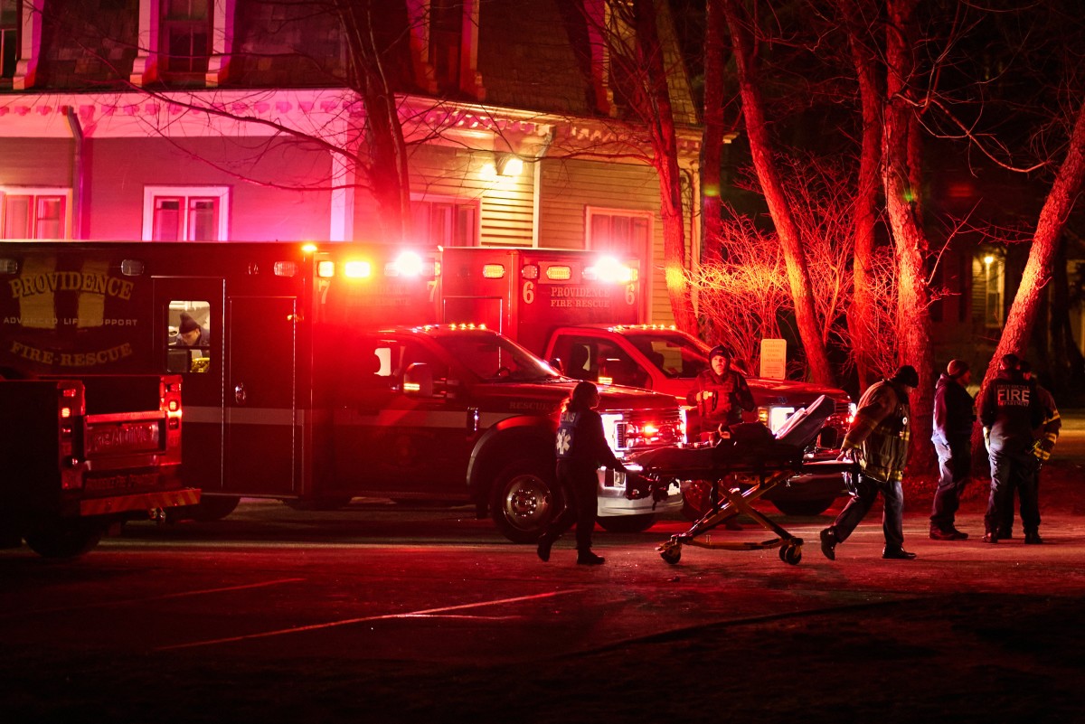 First responders with the Providence Fire Department maneuver an empty stretcher near the Barus & Holley building, home to the engineering and physics departments and the site of a mass shooting, at Brown University campus in Providence, Rhode Island, on December 13, 2025.A gunman killed two people and critically wounded eight others in the afternoon of December 13 at prestigious Brown University, authorities said, urging people in the area to remain in lockdown as the attacker was still at large.