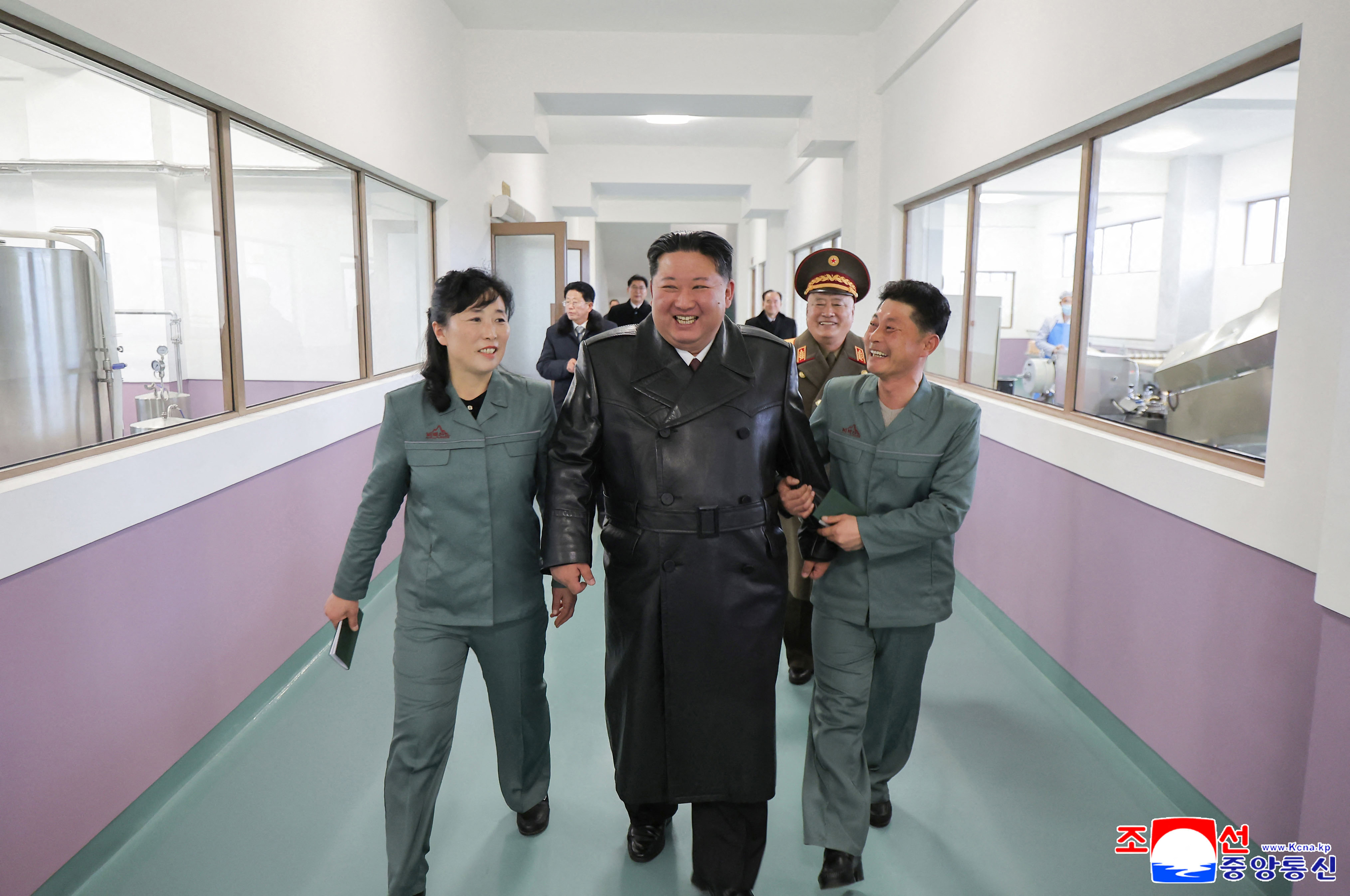 This picture taken on December 24, 2025 shows North Korean leader Kim Jong Un, centre, inspecting a factory in South Hamgyong Province, North Korea [KCNA via KNS/AFP]