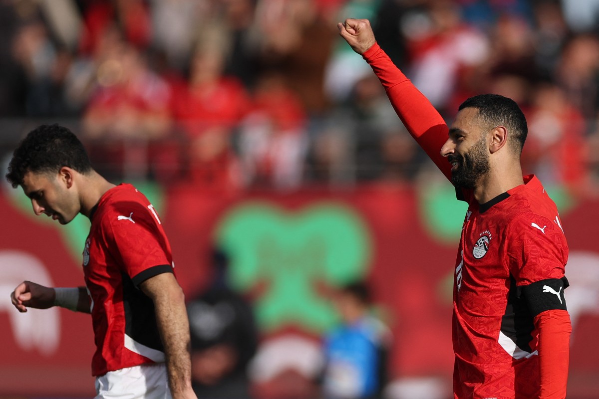 Egypt's forward #10 Mohamed Salah celebrates scoring the team's first goal from a penalty