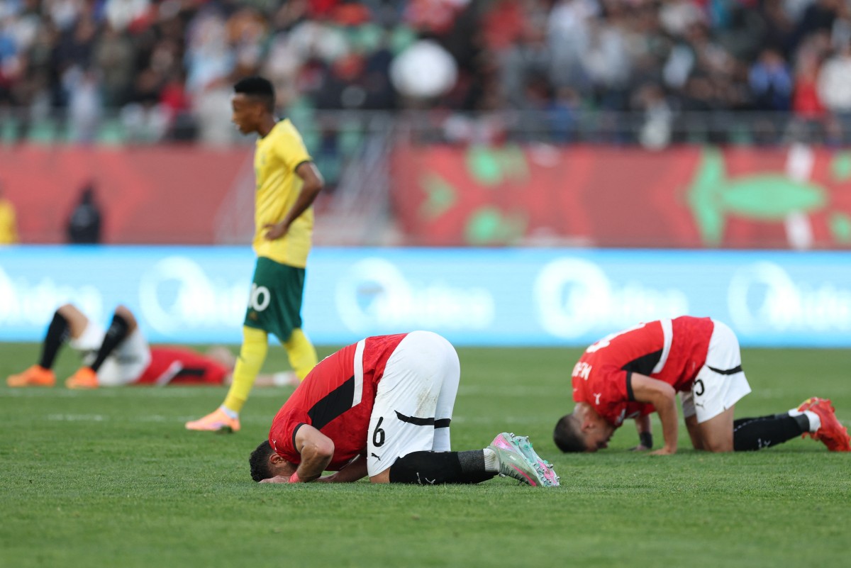 Egypt's defender #06 Yasser Ibrahim and Egypt's defender #05 Ramy Rabia react after winning the Africa Cup of Nations