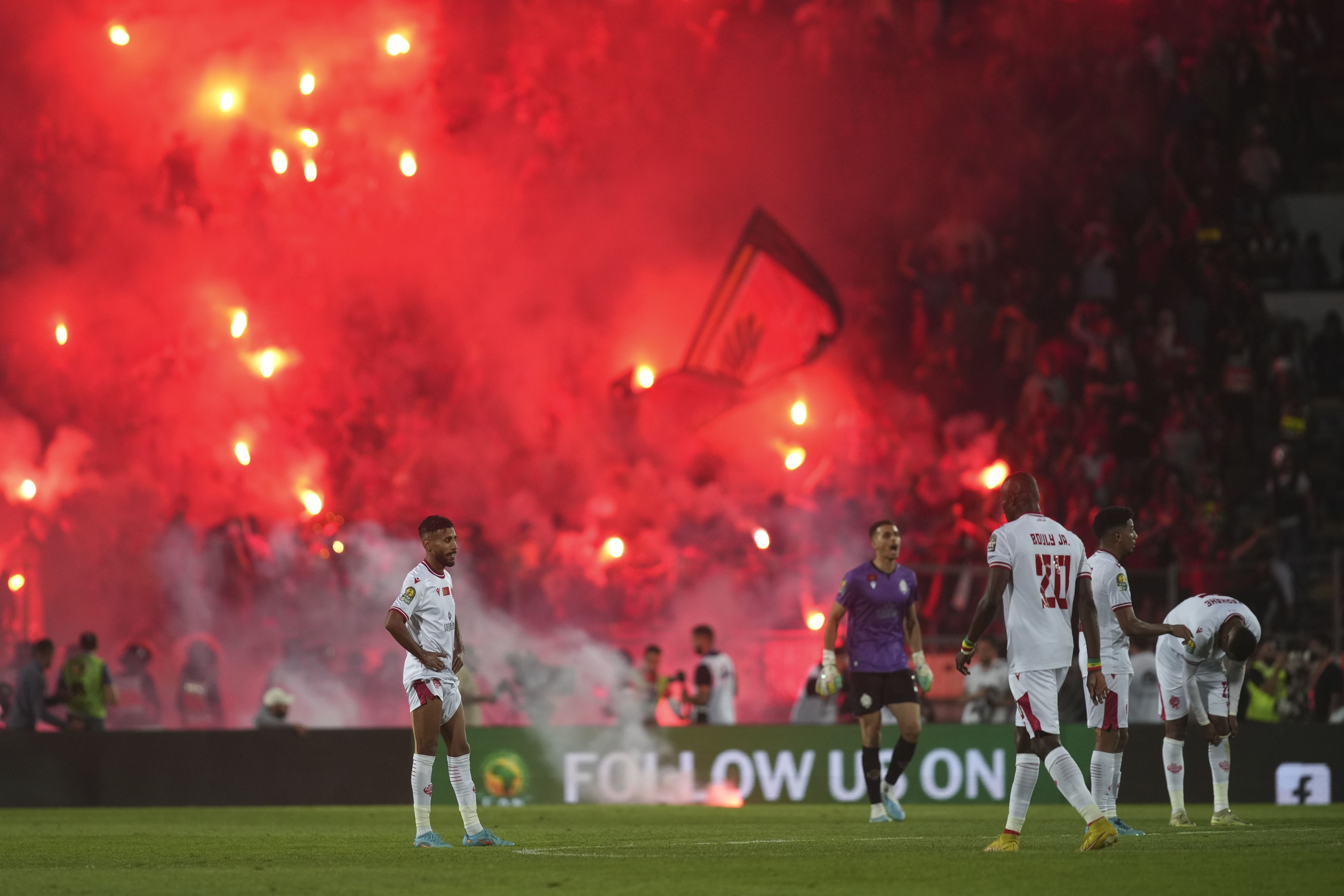 Wydad's players react after Al Ahly's Mohamed Abdelmonem scored his side's opening goal during the CAF Champions League final soccer match between Morocco's Wydad Athletic Club and Egypt's Al Ahly SC, at the Mohammed V stadium, in Casablanca, Morocco, Sunday, June 11, 2023. (AP Photo/Mosa'ab Elshamy)
