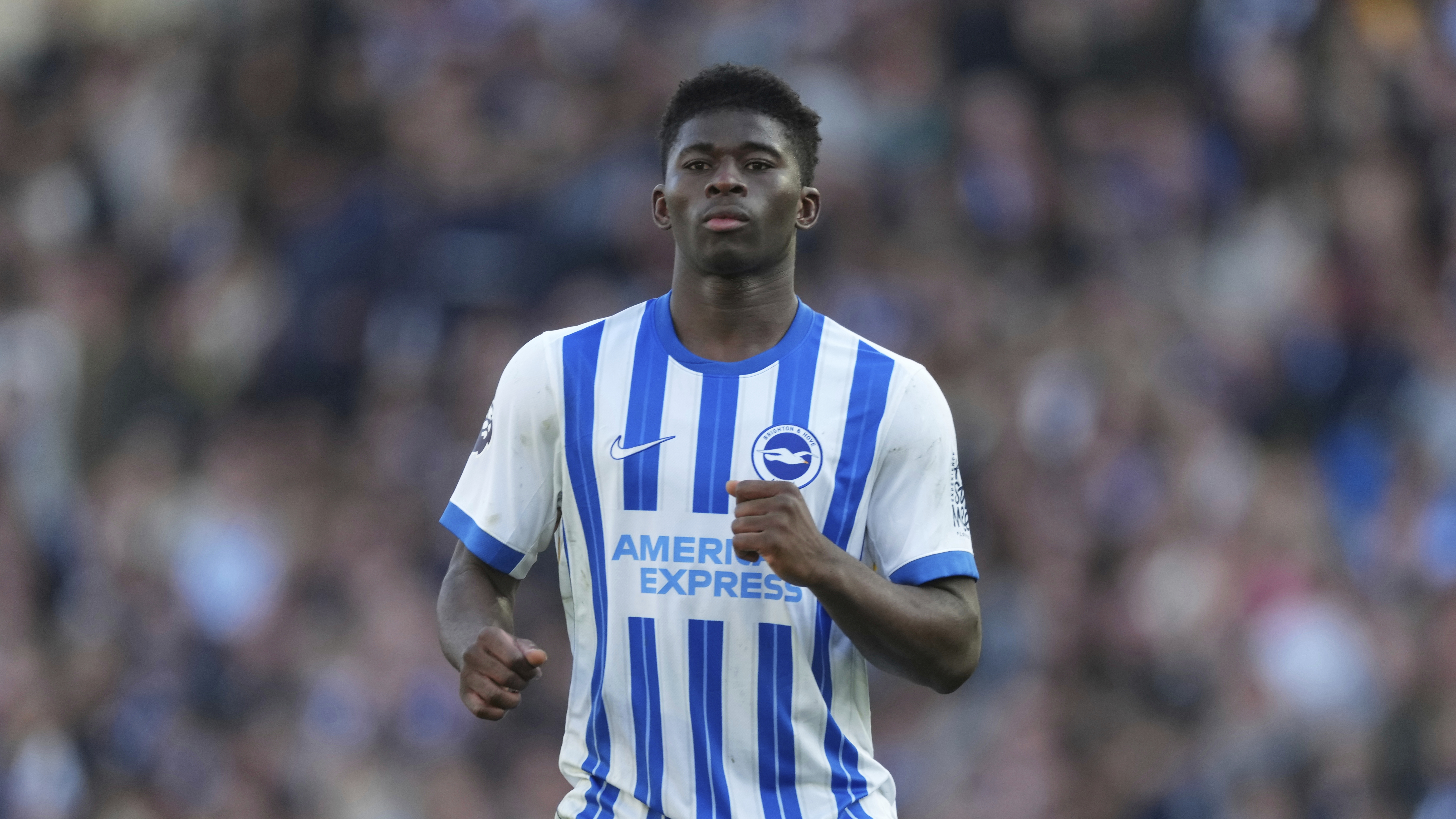 Brighton's Carlos Baleba runs into position during the English Premier League soccer match between Brighton and Hove Albion and Fulham, at the Amex Stadium in Brighton, England, Saturday, March 8, 2025. (AP Photo/Dave Shopland)