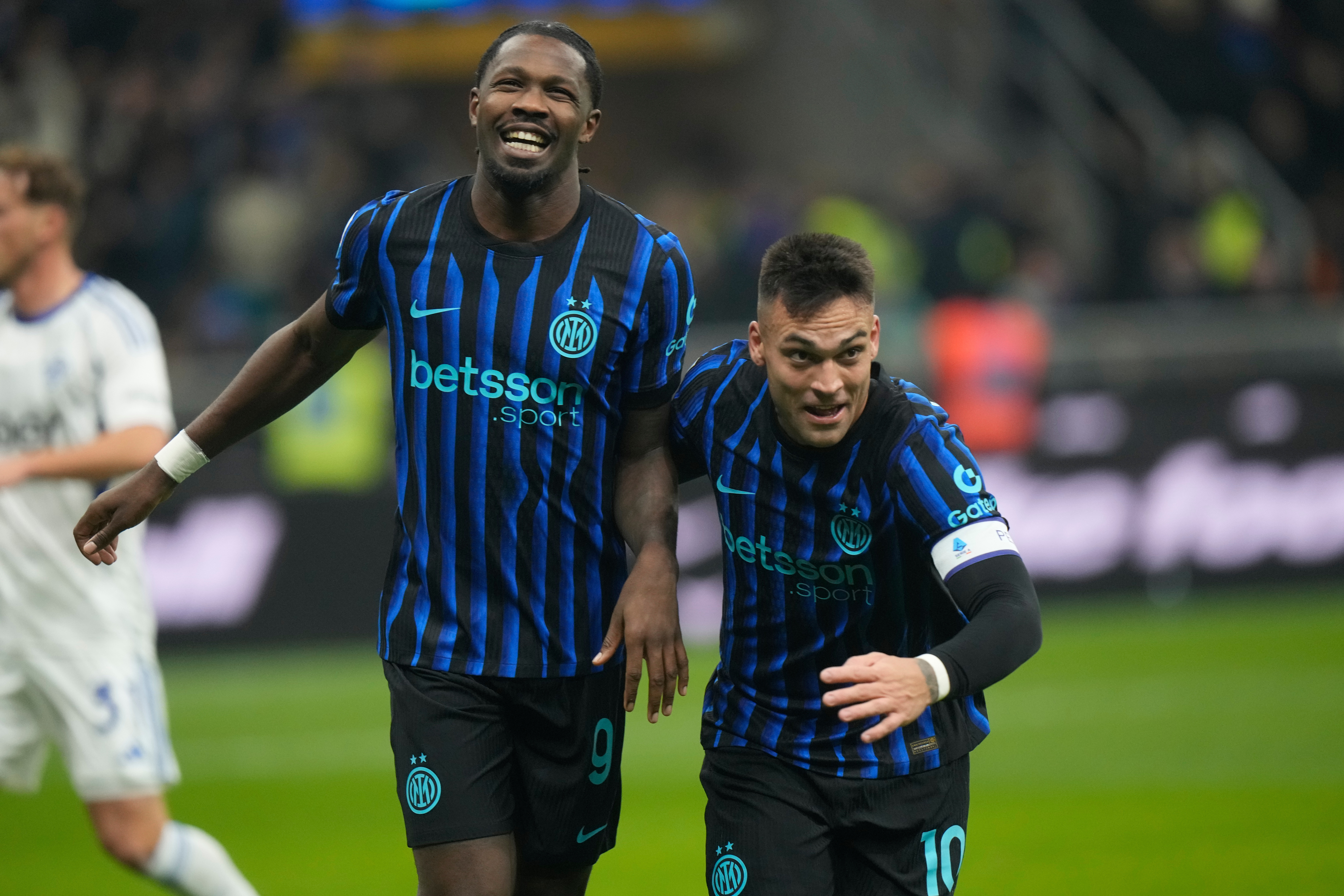 Marcus Thuram and Lautaro Martinez react.