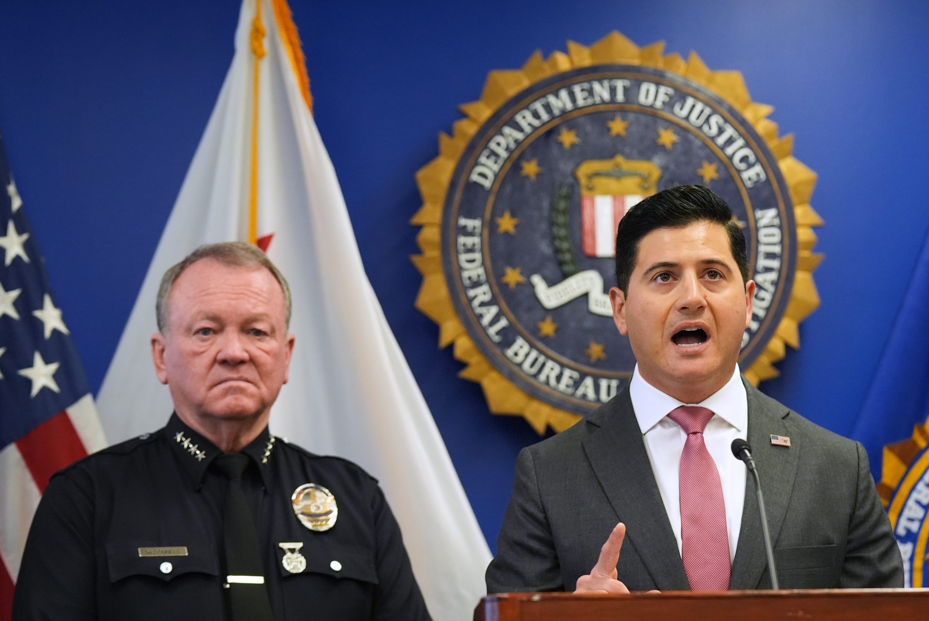 First Assistant United States Attorney Bill Essayli, right, speaks at a news conference.