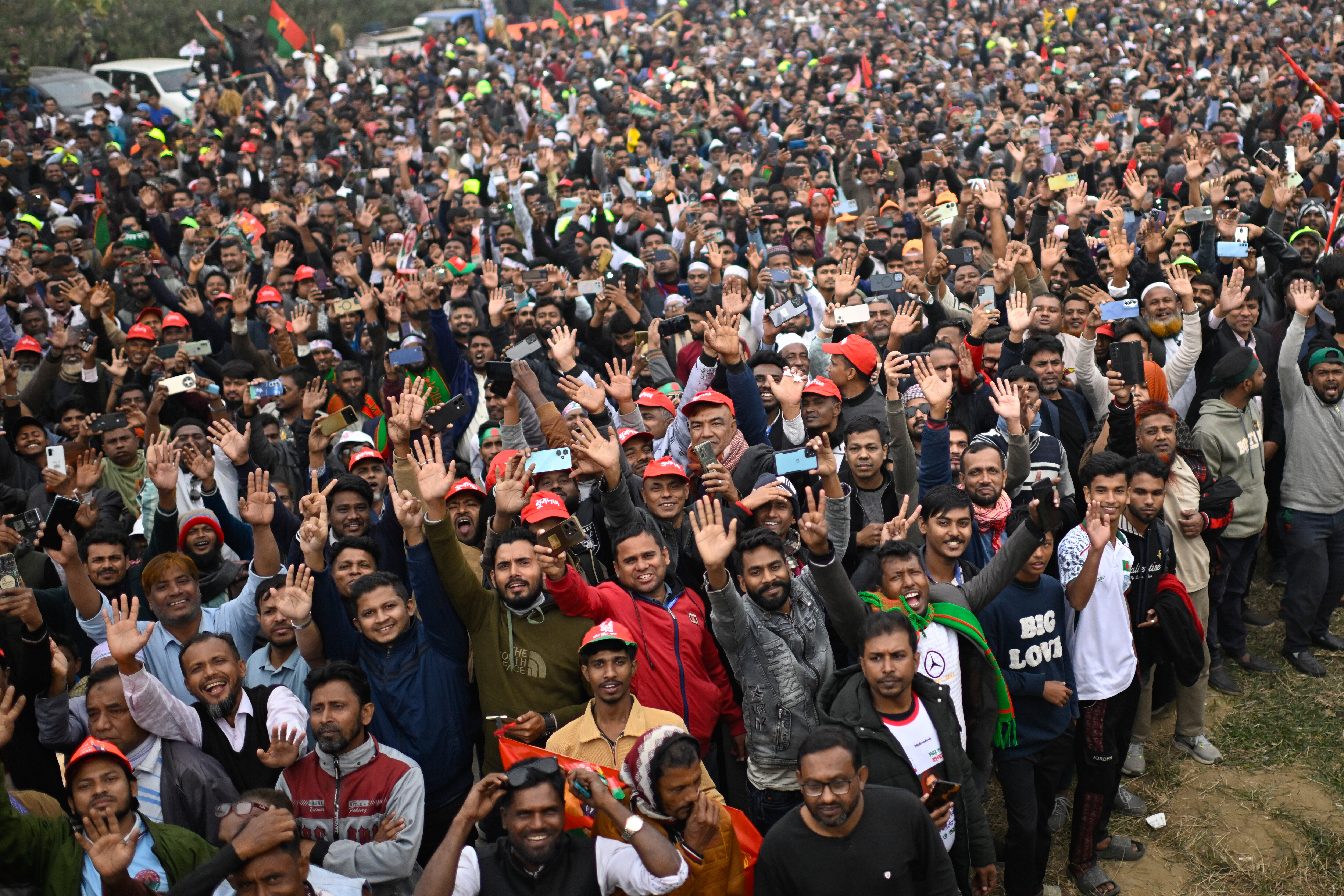 Supporters of Bangladesh Nationalist Party (BNP) Acting Chairman Tarique Rahman shout slogans following his arrival at Hazrat Shahjalal International Airport in Dhaka after more than 17 years of self-imposed exile in London, Thursday, Dec. 25, 2025. (AP Photo/ Mahmud Hossain Opu)
