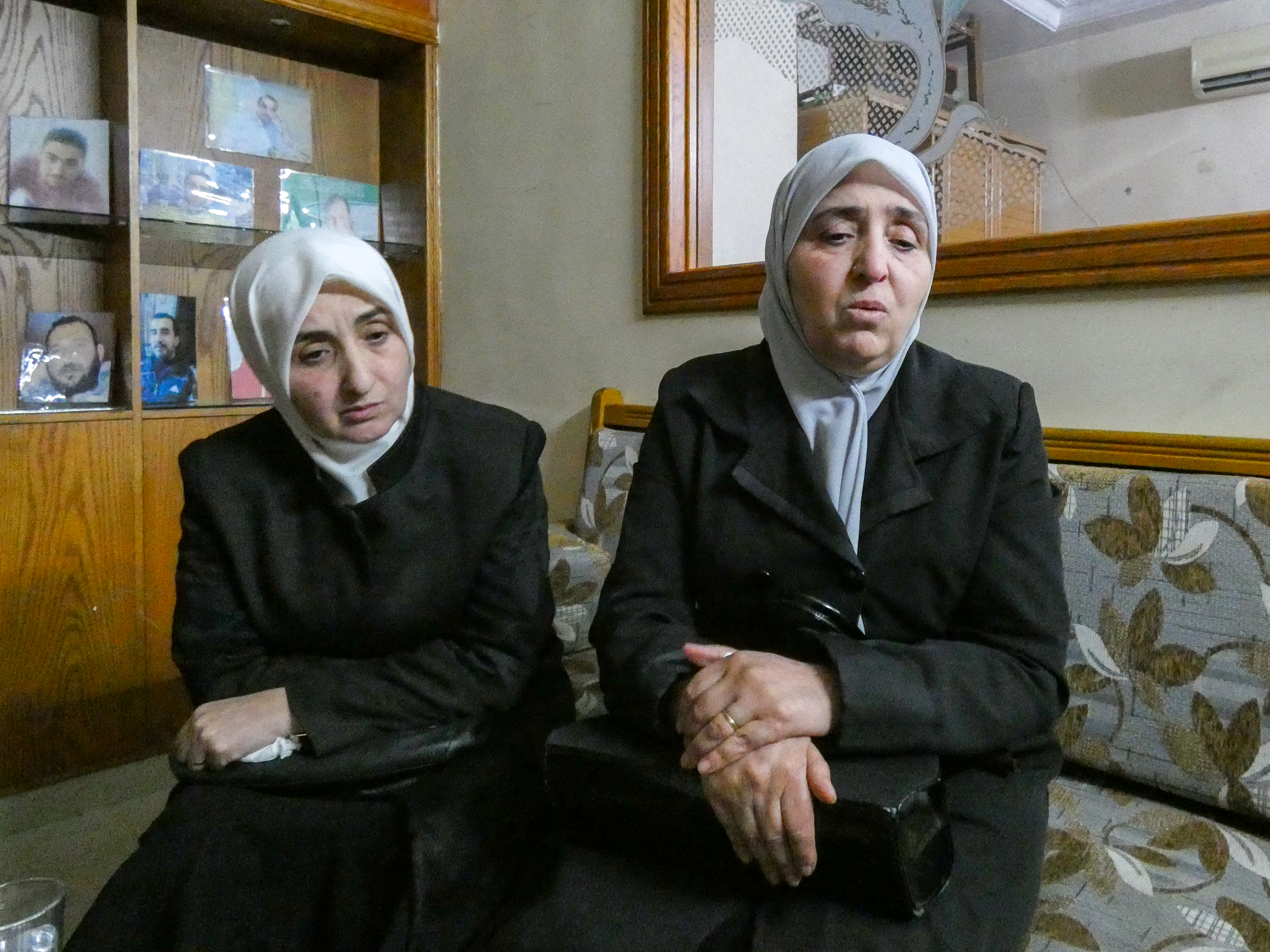 Najwa, 60, and Ghada, 55, sitting in a living room in Damascus.