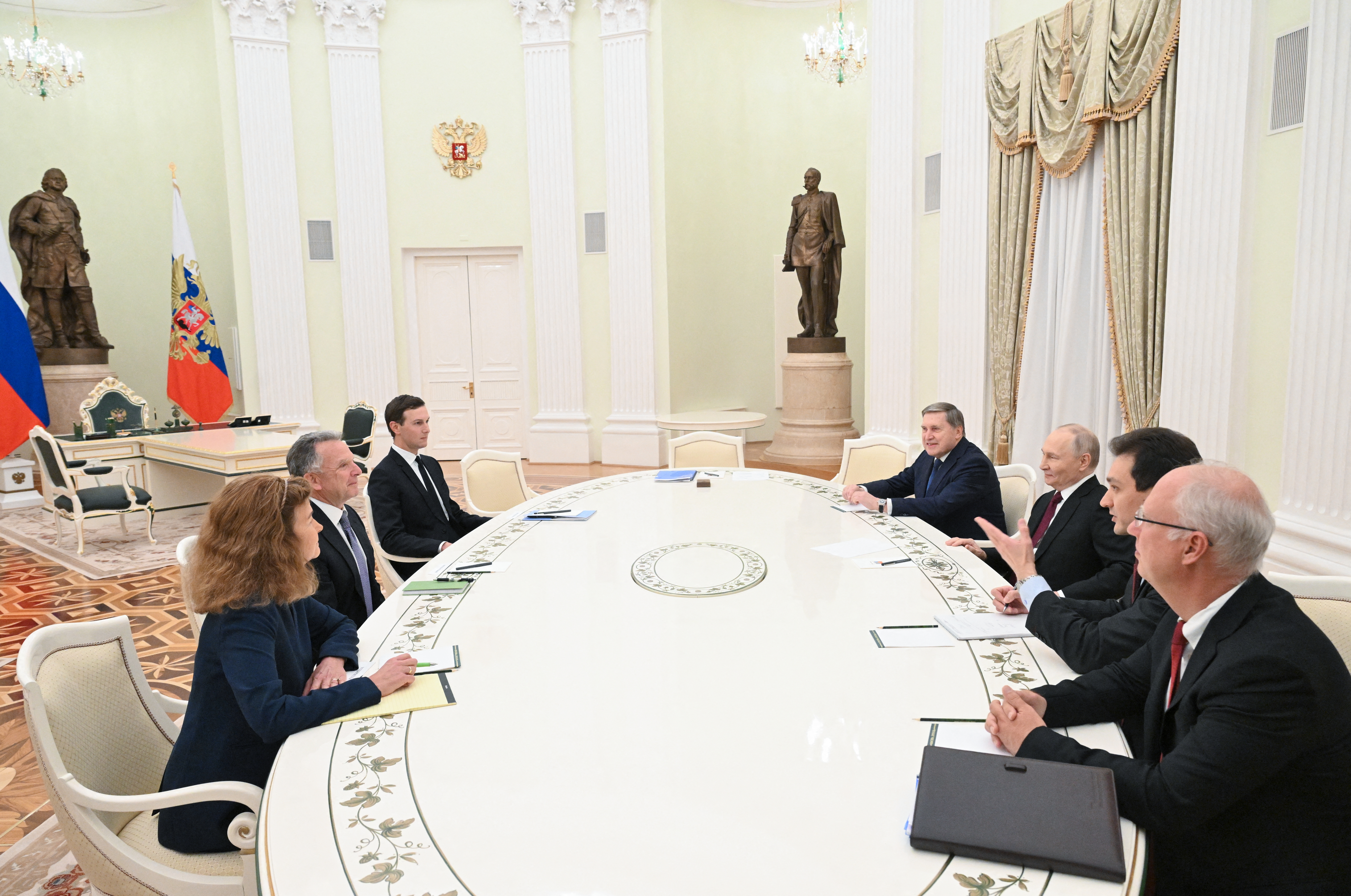 In this pool photograph distributed by the Russian state agency Sputnik, Russia's President Vladimir Putin, accompanied by Kremlin economic envoy Kirill Dmitriev and Kremlin aide Yuri Ushakov, meets with US special envoy Steve Witkoff and US President Donald Trump's son-in-law Jared Kushner at the Kremlin in Moscow on December 2, 2025. (Photo by Kristina Kormilitsyna / POOL / AFP)