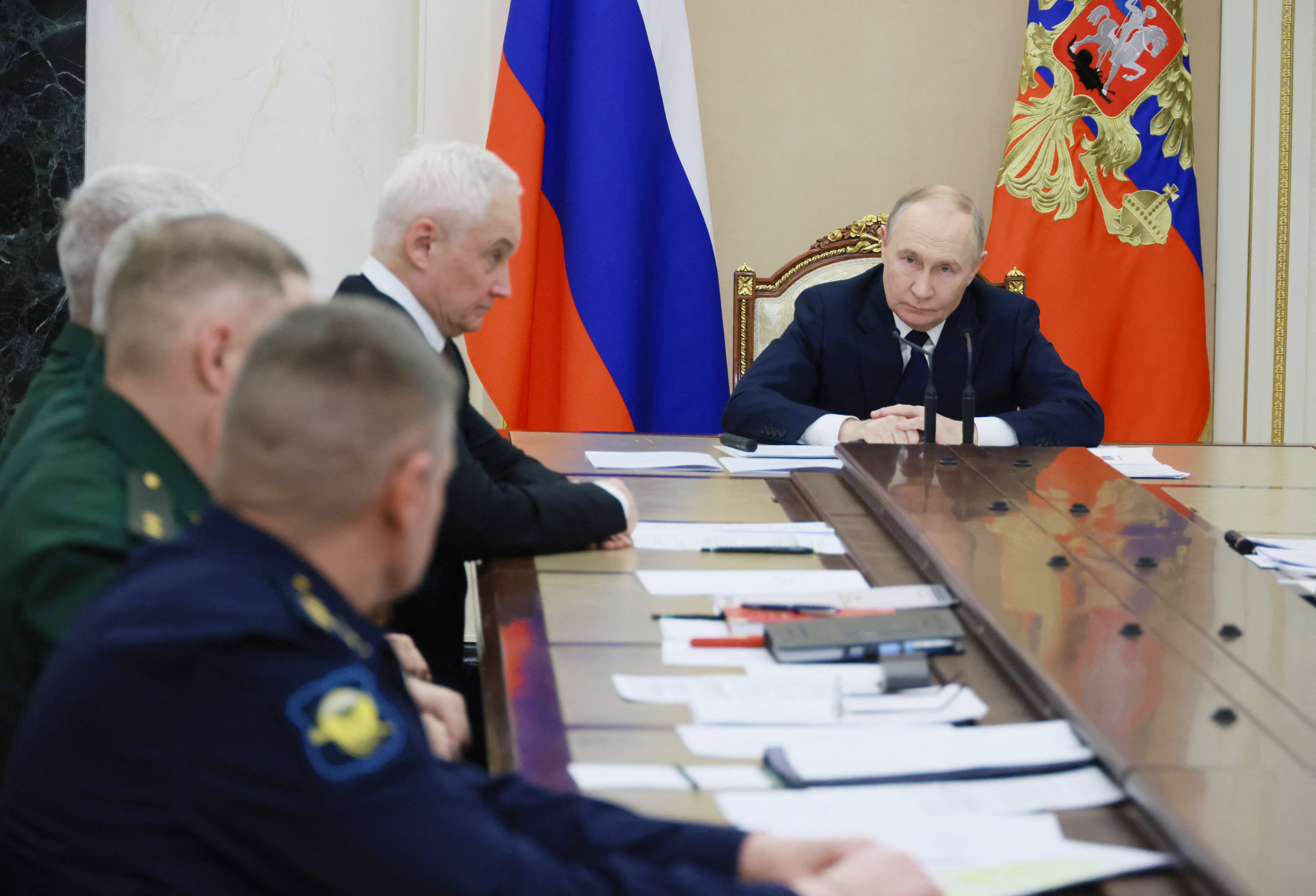 In this pool photograph distributed by the Russian state agency Sputnik, Russia's President Vladimir Putin chairs a meeting on situation in the zone of the "special military operation", the Kremlin's term for the nearly four-year-long Ukraine offensive, in Moscow on December 29, 2025. (Photo by Mikhail METZEL / POOL / AFP)