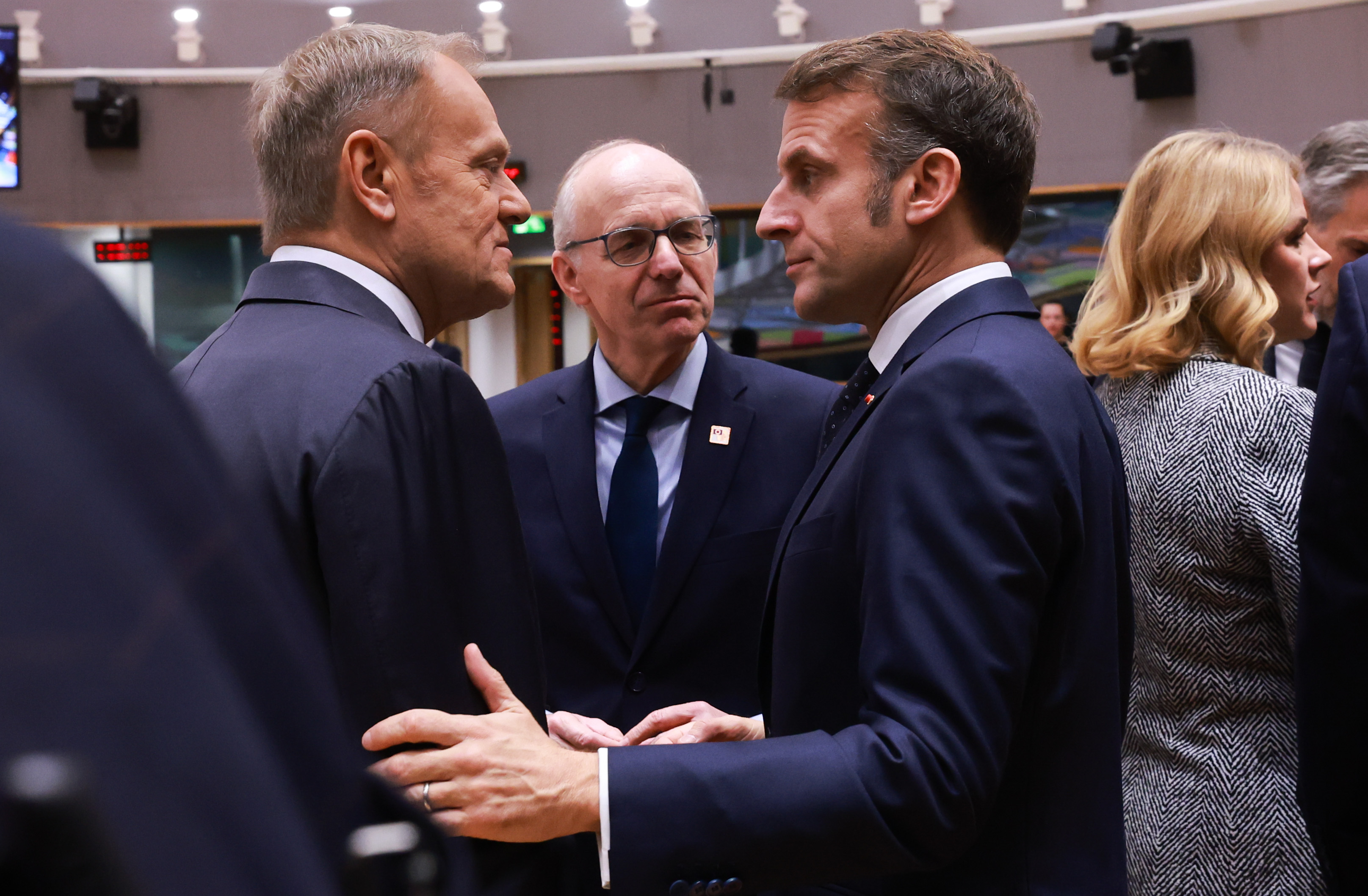 epa12600649 (L-R) Poland's Prime Minister Donald Tusk, Luxembourg's Prime Minister Luc Frieden and French President Emmanuel Macron during the EU Council Summit in Brussels, Belgium, 18 December 2025. EU leaders are meeting to discuss the latest developments in Ukraine, the EU's next multiannual financial framework, the EU enlargement process, and the geoeconomic situation in the European Union. EPA/OLIVIER HOSLET