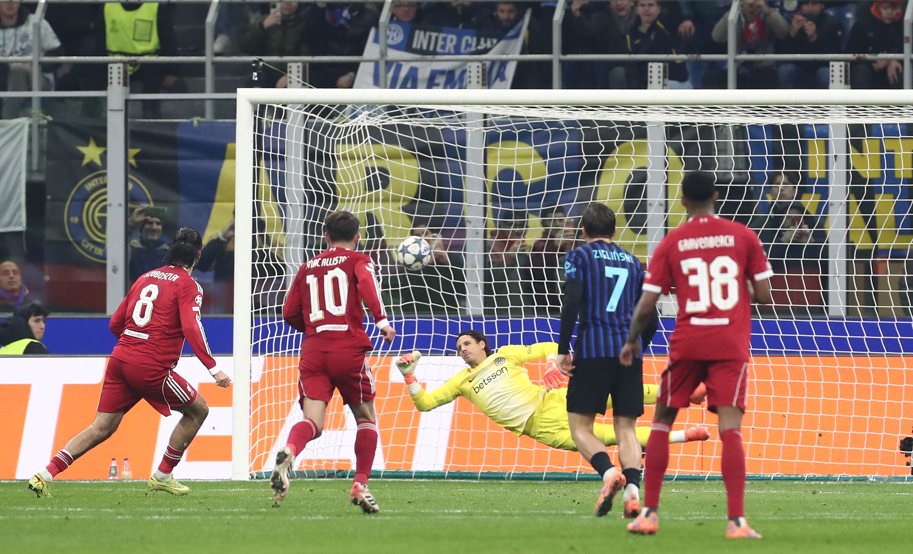 MILAN, ITALY - DECEMBER 09: Dominik Szoboszlai of Liverpool FC scores their team's first goal during the UEFA Champions League 2025/26 League Phase MD6 match between FC Internazionale Milano and Liverpool FC at Stadio San Siro on December 09, 2025 in Milan, Italy. (Photo by Marco Luzzani/Getty Images)
