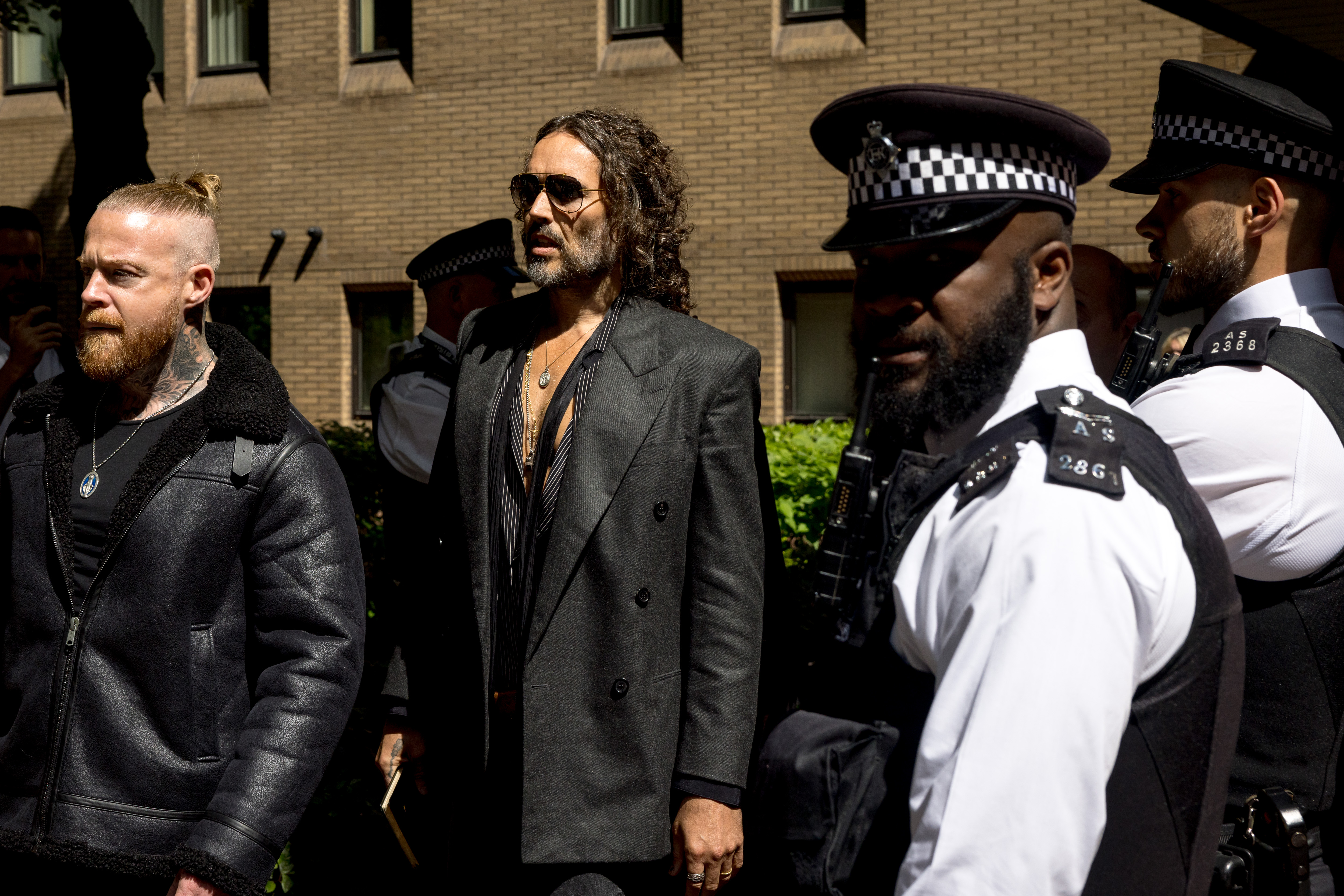 LONDON, ENGLAND - MAY 30: Russell Brand leaves Southwark Crown Court after pleading not guilty on May 30, 2025 in London, England. The charges relate to accusations of rape, indecent assault and sexual assault between 1999 and 2005. (Photo by Jack Taylor/Getty Images)