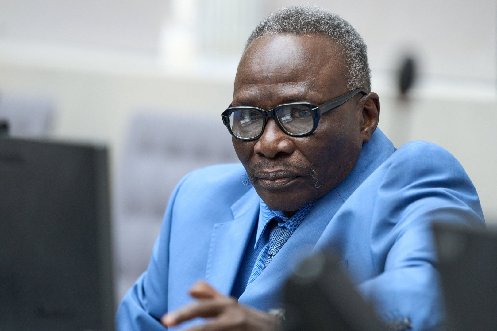Ali Muhammad Ali Abd al-Rahman, a Sudanese national, waits to hear the verdict of the International Criminal Court, ICC, in The Hague, Netherlands on Dec. 9, 2025. [Peter Dejong/Reuters]