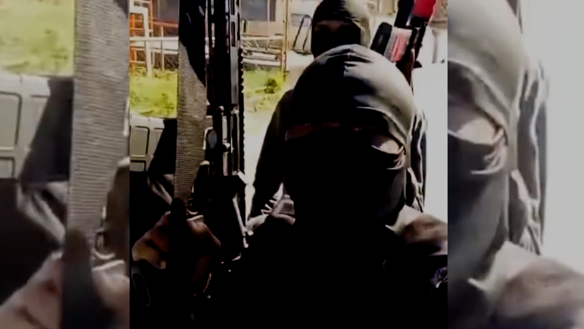 Young men showing off military weapons in gang-controlled Rio de Janeiro. [Al Jazeera]