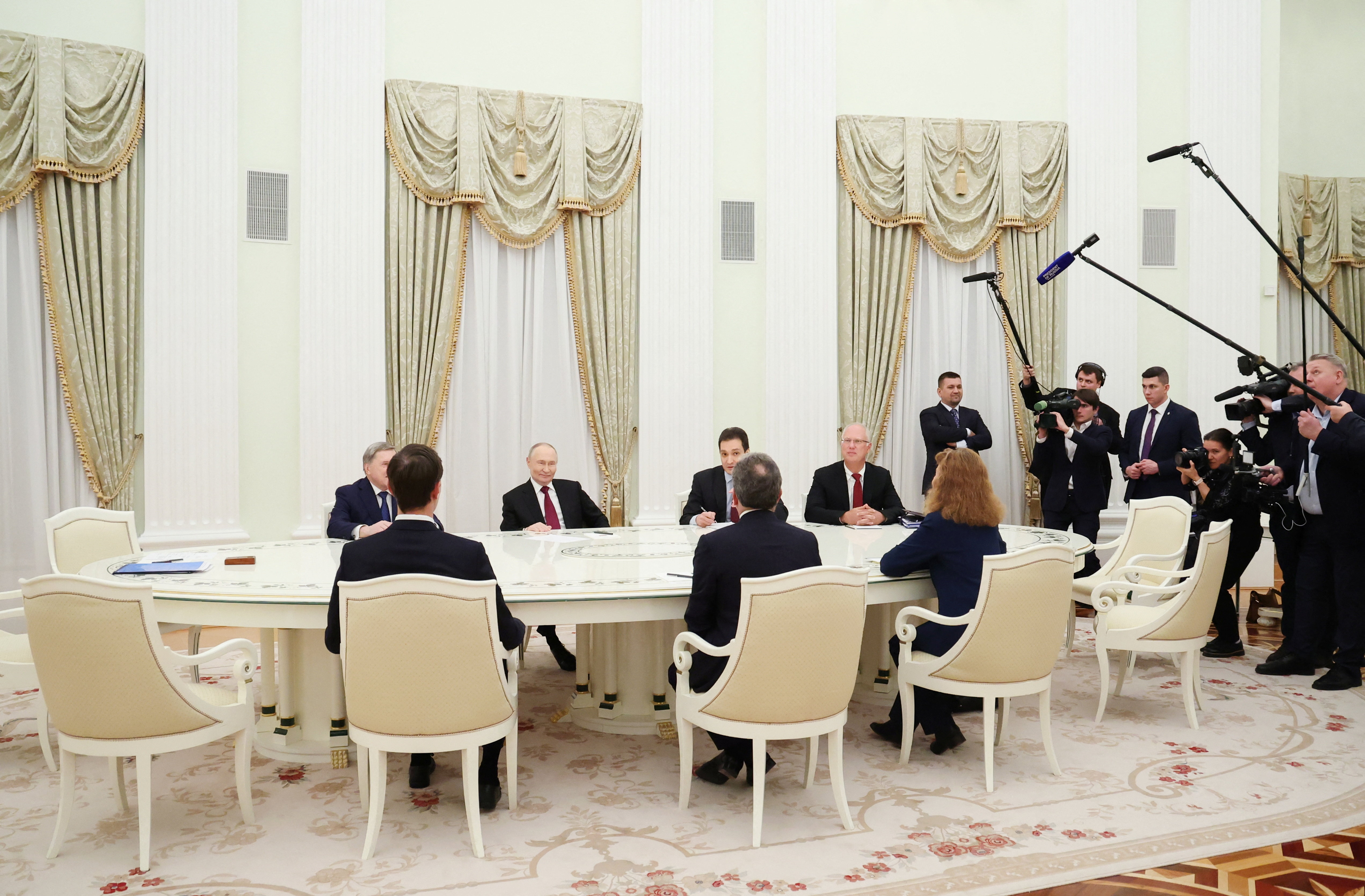Russian President Vladimir Putin, presidential envoy Kirill Dmitriev and foreign policy aide Yuri Ushakov attend a meeting with U.S. President Donald Trump's special envoy Steve Witkoff and son-in-law Jared Kushner at the Kremlin in Moscow, Russia, December 2, 2025. Sputnik/Alexander Kazakov/Pool via REUTERS ATTENTION EDITORS - THIS IMAGE WAS PROVIDED BY A THIRD PARTY.