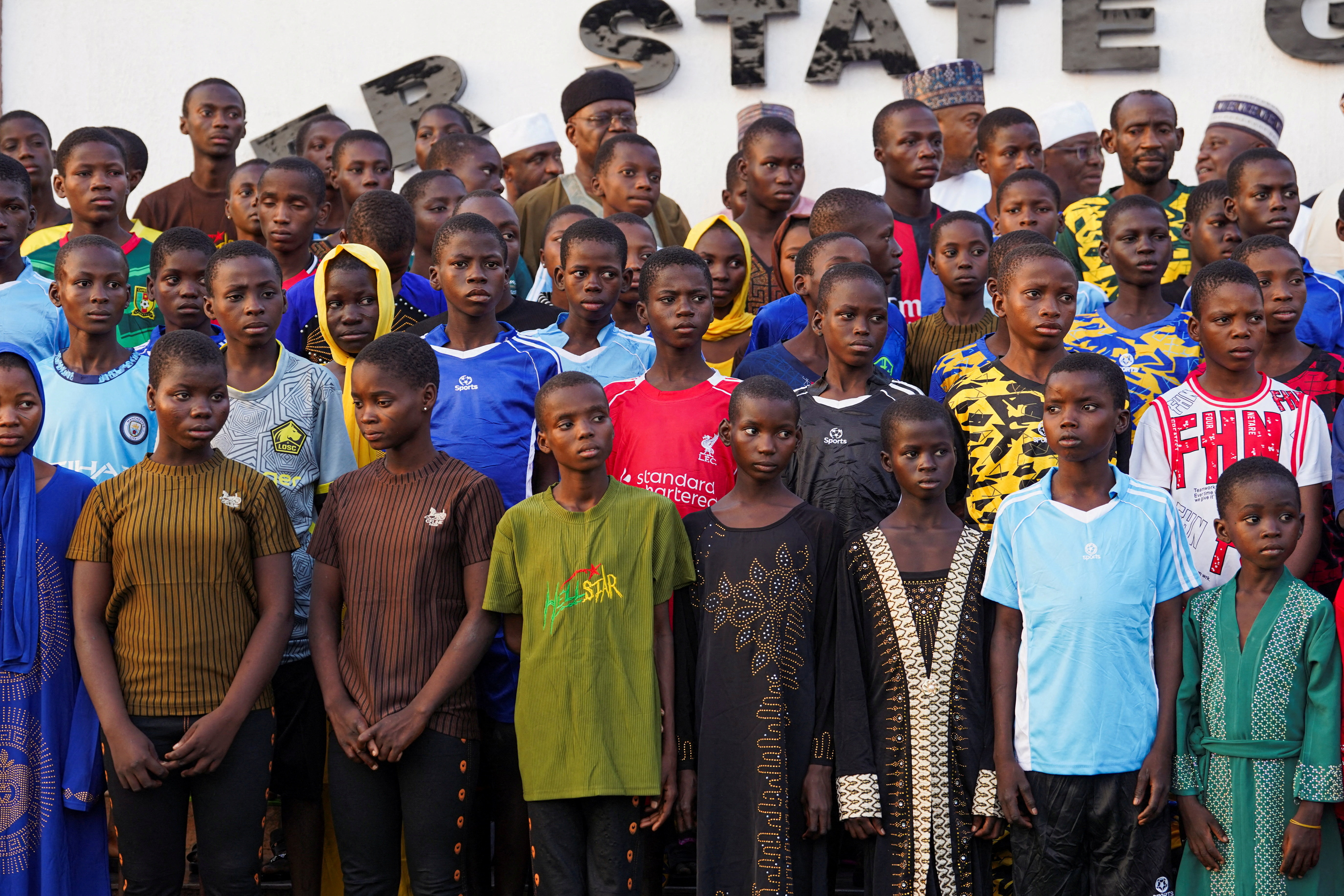 Schoolchildren abducted from St. Mary’s School pose for a photograph after arriving at the Niger State Government House following their rescue, in Minna, Nigeria, December 8, 2025. REUTERS/Marvellous Durowaiye TPX IMAGES OF THE DAY