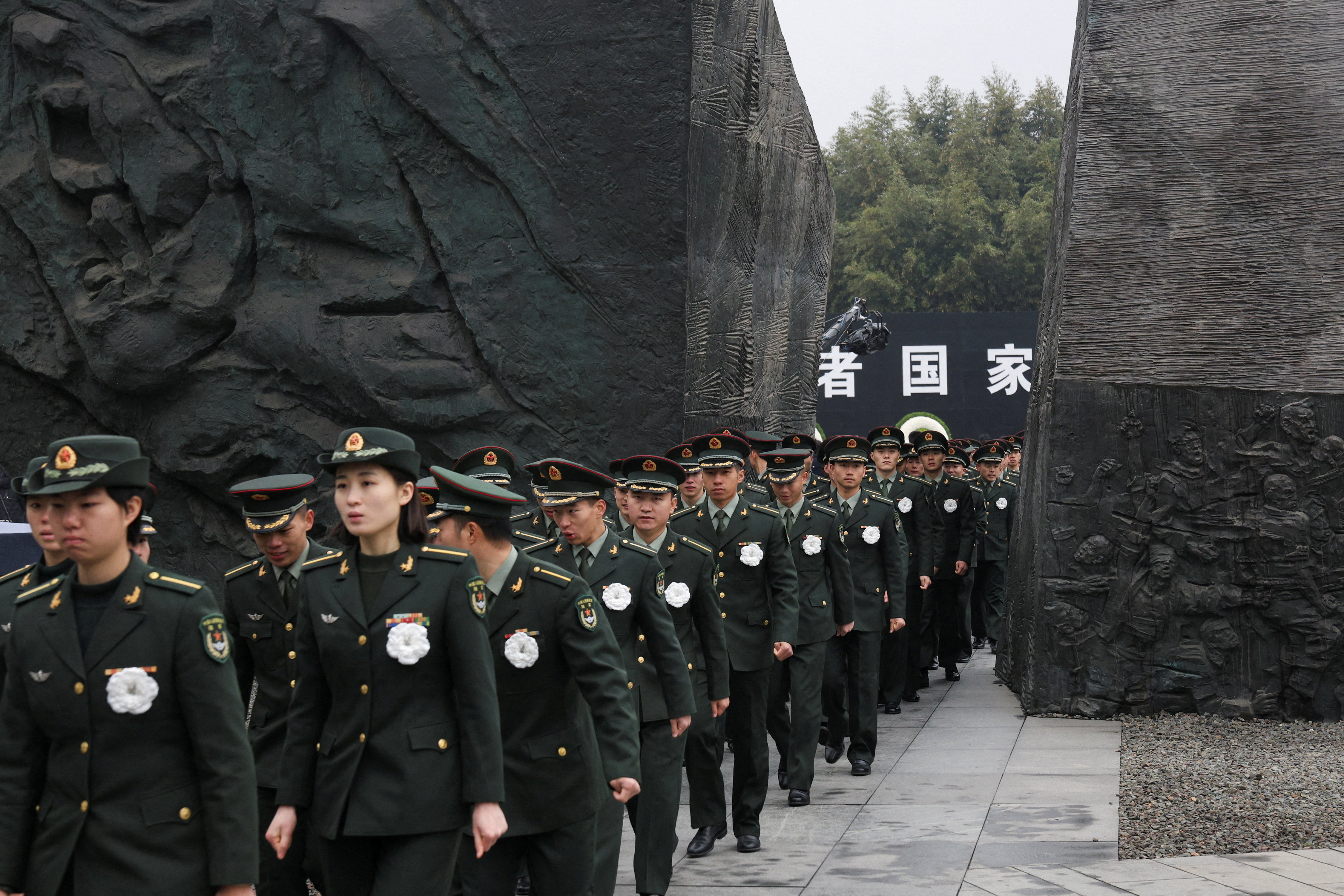 Participants attend the memorial ceremony to mark the 88th anniversary of the 1937 Nanjing Massacre on the National Memorial Day at the Nanjing Massacre Museum in Nanjing, Jiangsu Province, China, December 13, 2025. REUTERS/Staff TPX IMAGES OF THE DAY