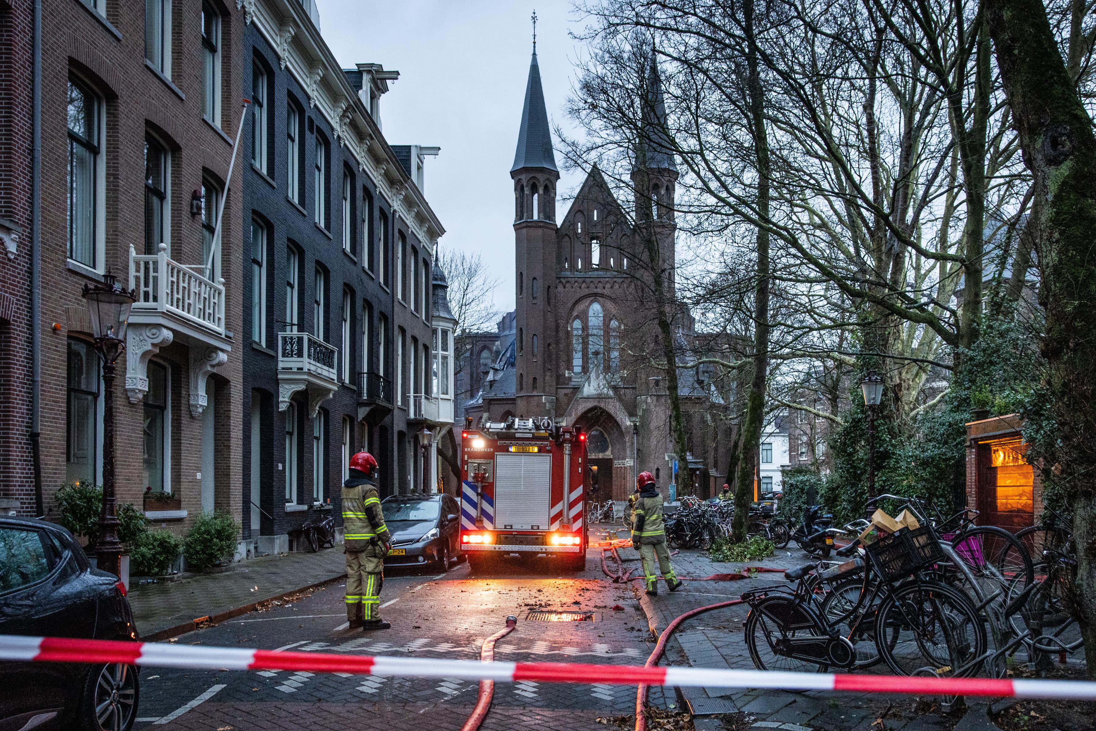 Firefighters continue to work at the Vondelkerk Church after it caught fire in Amsterdam, The Netherlands on January 1, 2026.