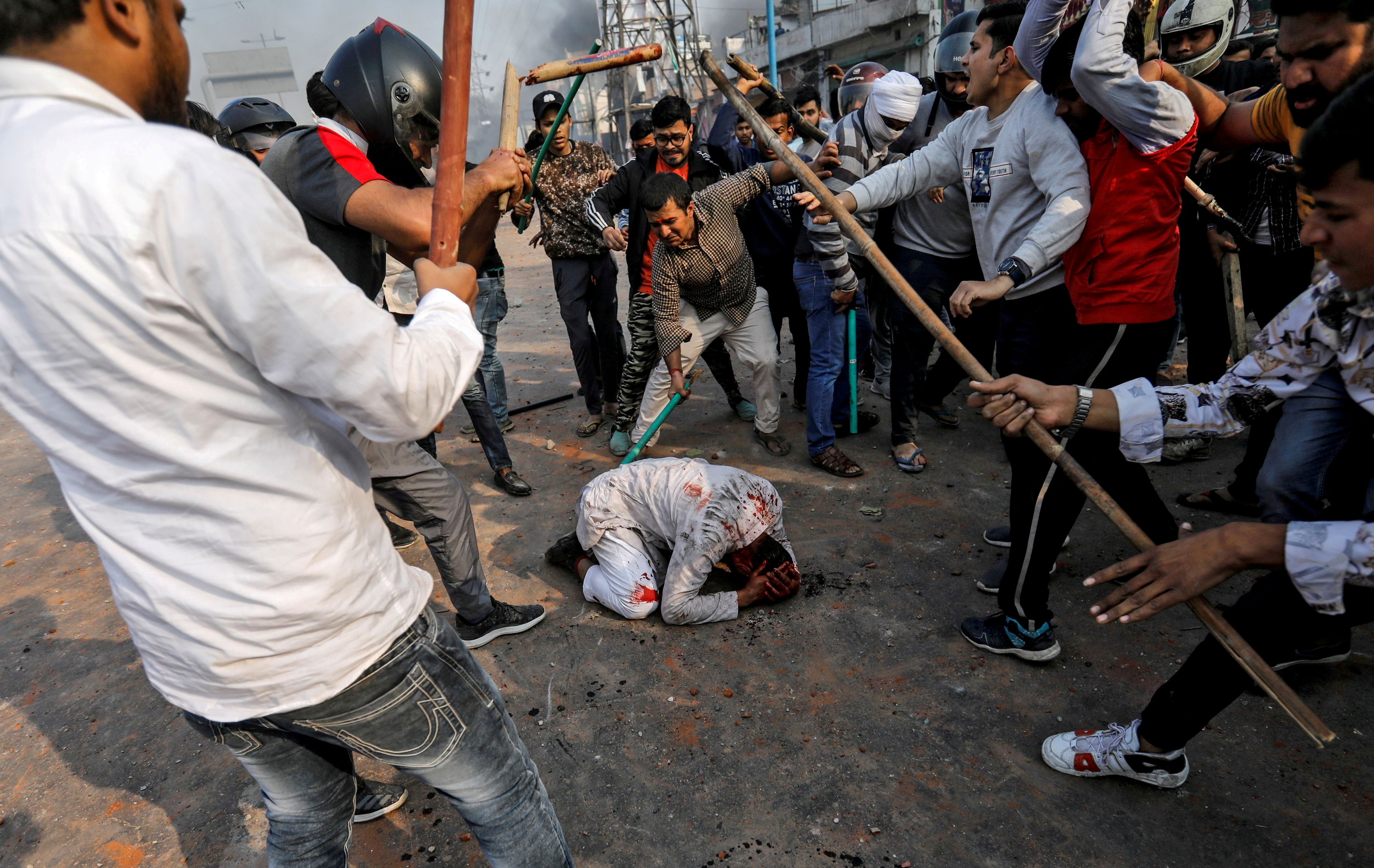 A group of men, chanting pro-Hindu slogans, beat Mohammad Zubair, 37, who is Muslim, during protests sparked by a new citizenship law in New Delhi, India, February 24, 2020
