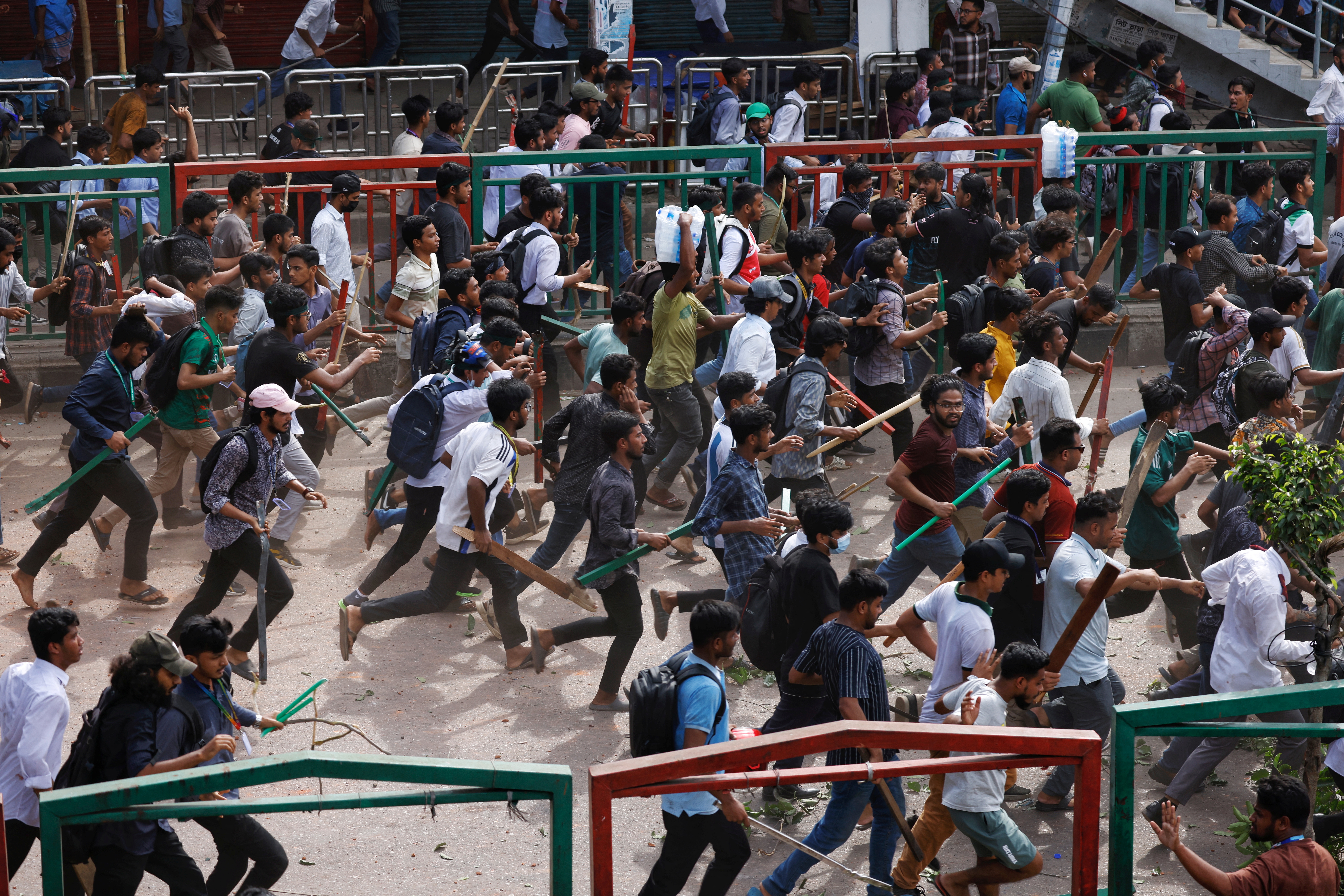 Bangladesh Chhatra League, the student wing of the ruling party Bangladesh Awami League, and anti-quota protesters engage in a clash at the Dhaka College area, in Dhaka, Bangladesh, July 16, 2024. REUTERS/Mohammad Ponir Hossain