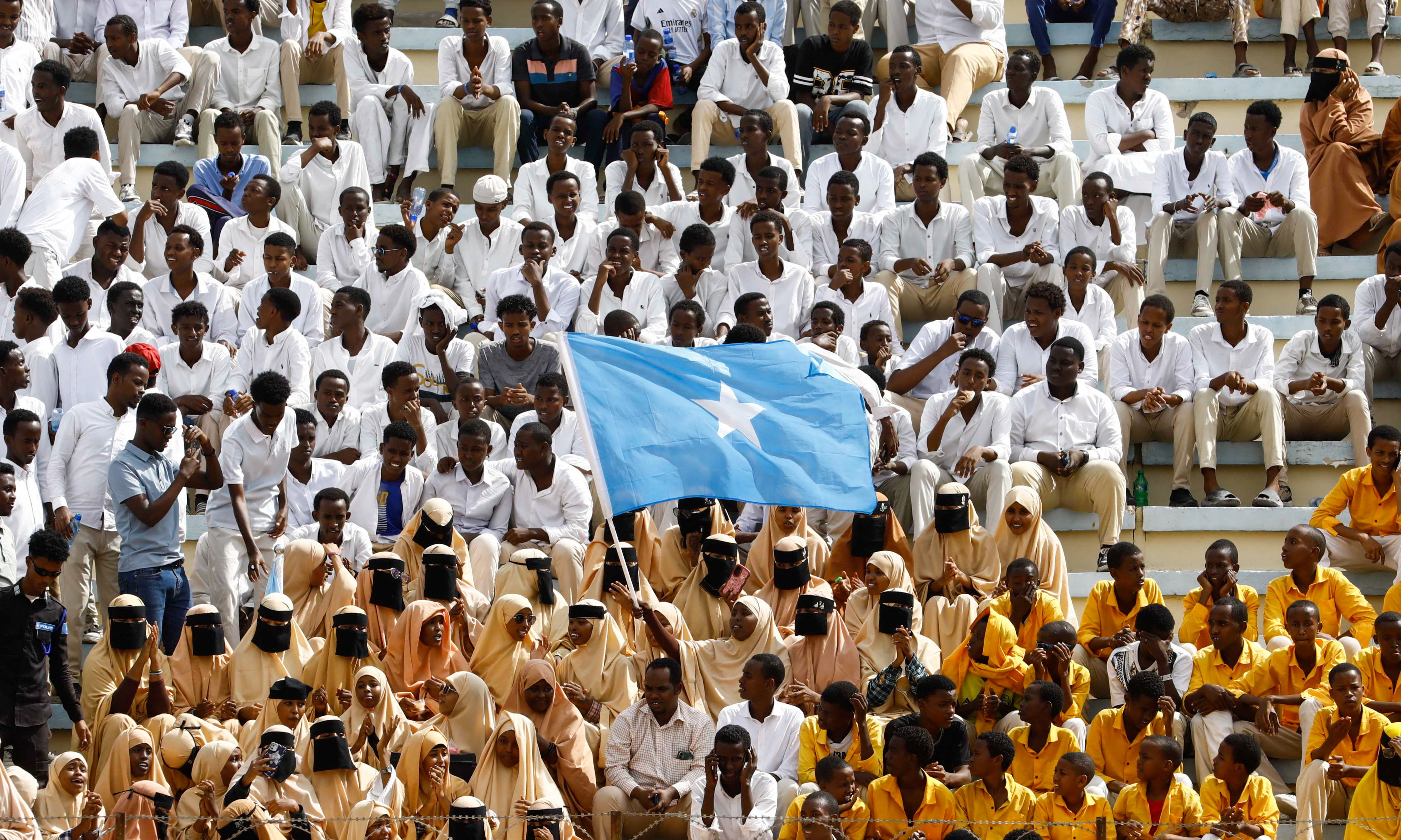 A student waves Somali national flag, during a demonstration after Israel became the first country to formally recognize the self-declared Republic of Somaliland as an independent and sovereign state, a decision that could reshape regional dynamics and test Somalia's longstanding opposition to secession, at the Mogadishu Stadium in Warta Nabada district of Mogadishu, Somalia December 30, 2025. REUTERS/Feisal Omar