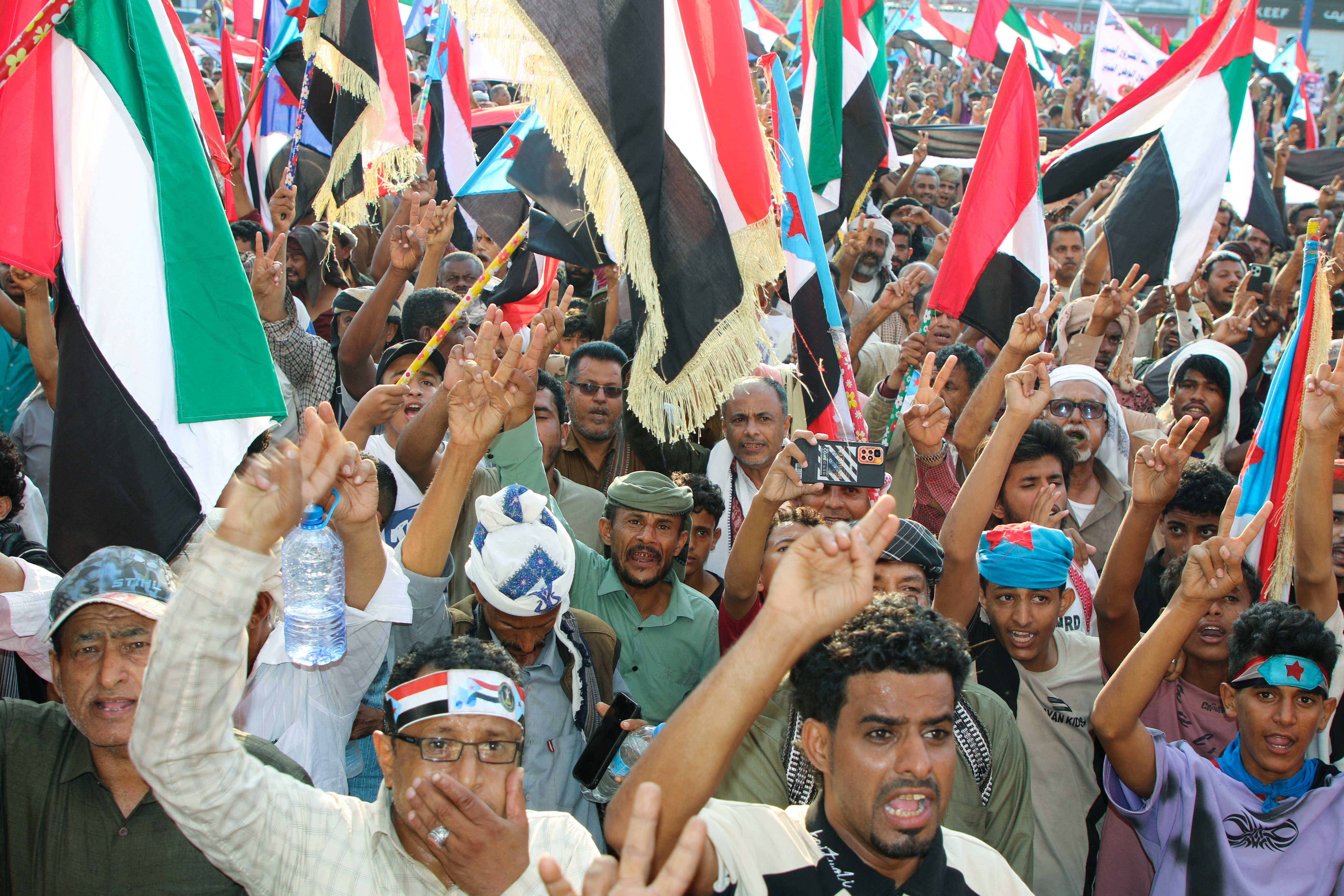 Supporters of the UAE-backed separatist Southern Transitional Council (STC) wave flags of the STC and the United Arab Emirates, during a rally in Aden, Yemen, January 1, 2026. [Fawaz Salman/Reuters]